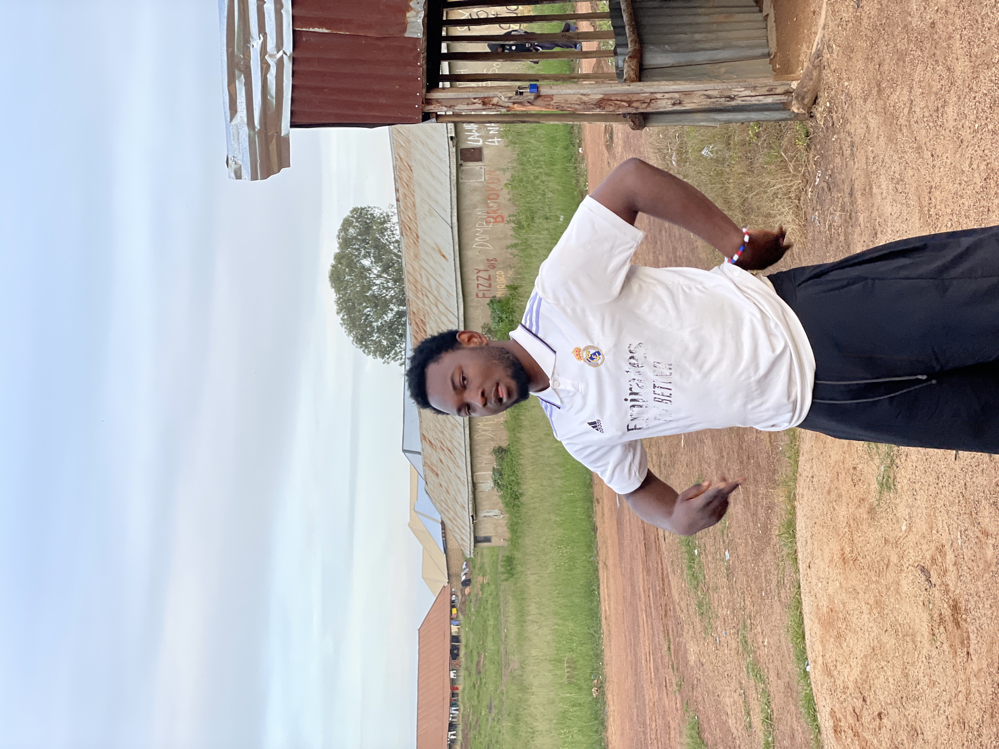 Outdoor barbershop and street life in Durumi, Nigeria