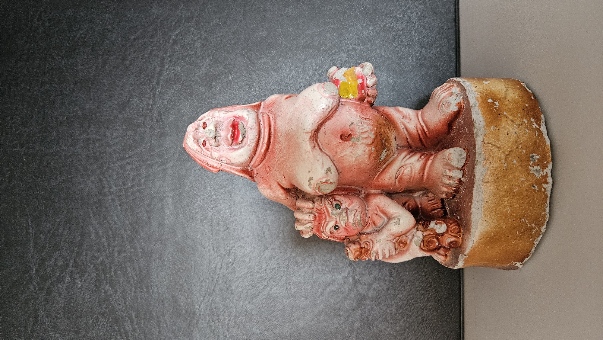 Witness documents weathered reddish statues depicting human figures