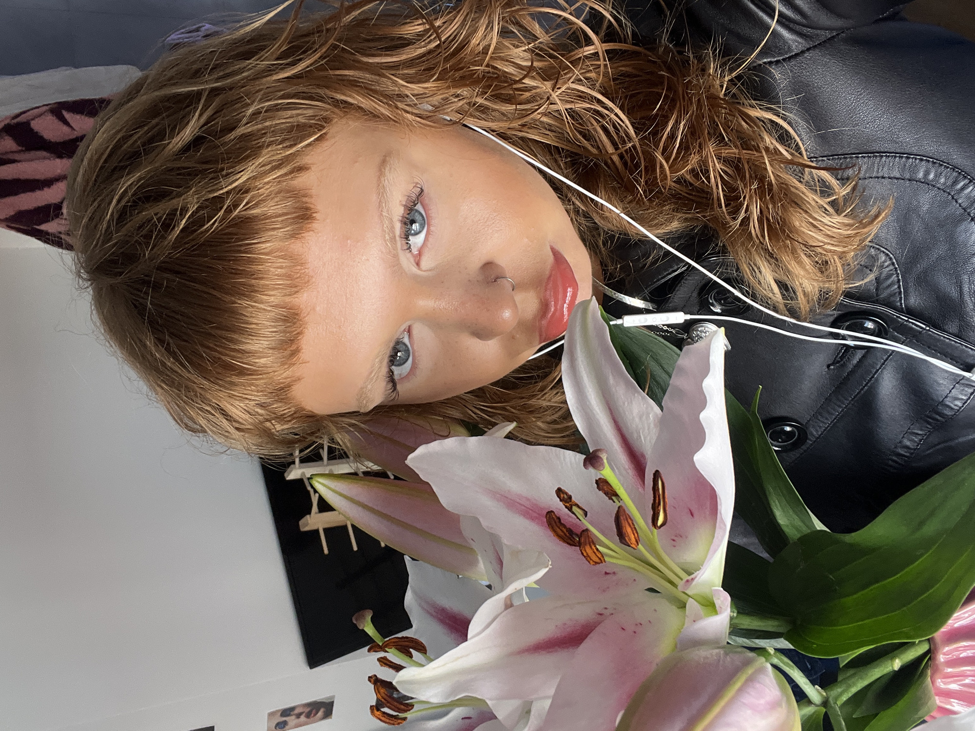 Woman poses with lily bouquet in London