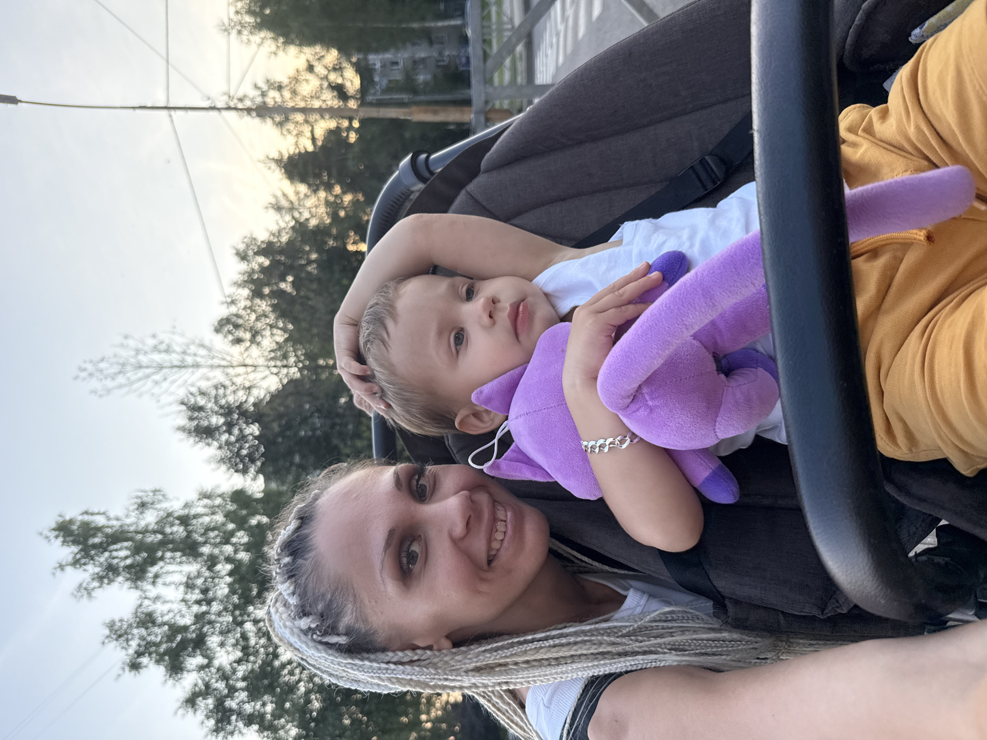 Evening stroll with a toddler on a quiet forested road in Rusanovo