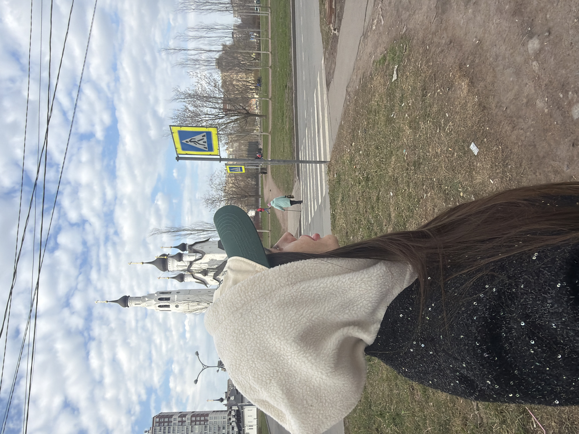 Person observes Orthodox church during afternoon stroll in Saint Petersburg