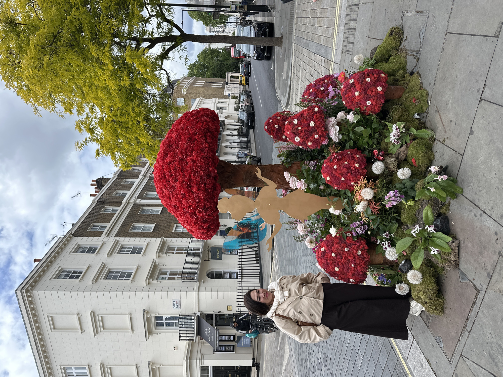 Elaborate floral displays documented outside London shops on Elizabeth Street