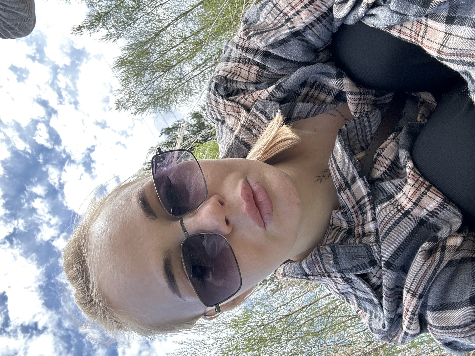 Woman photographs herself with dog in Vysokiy, Russia
