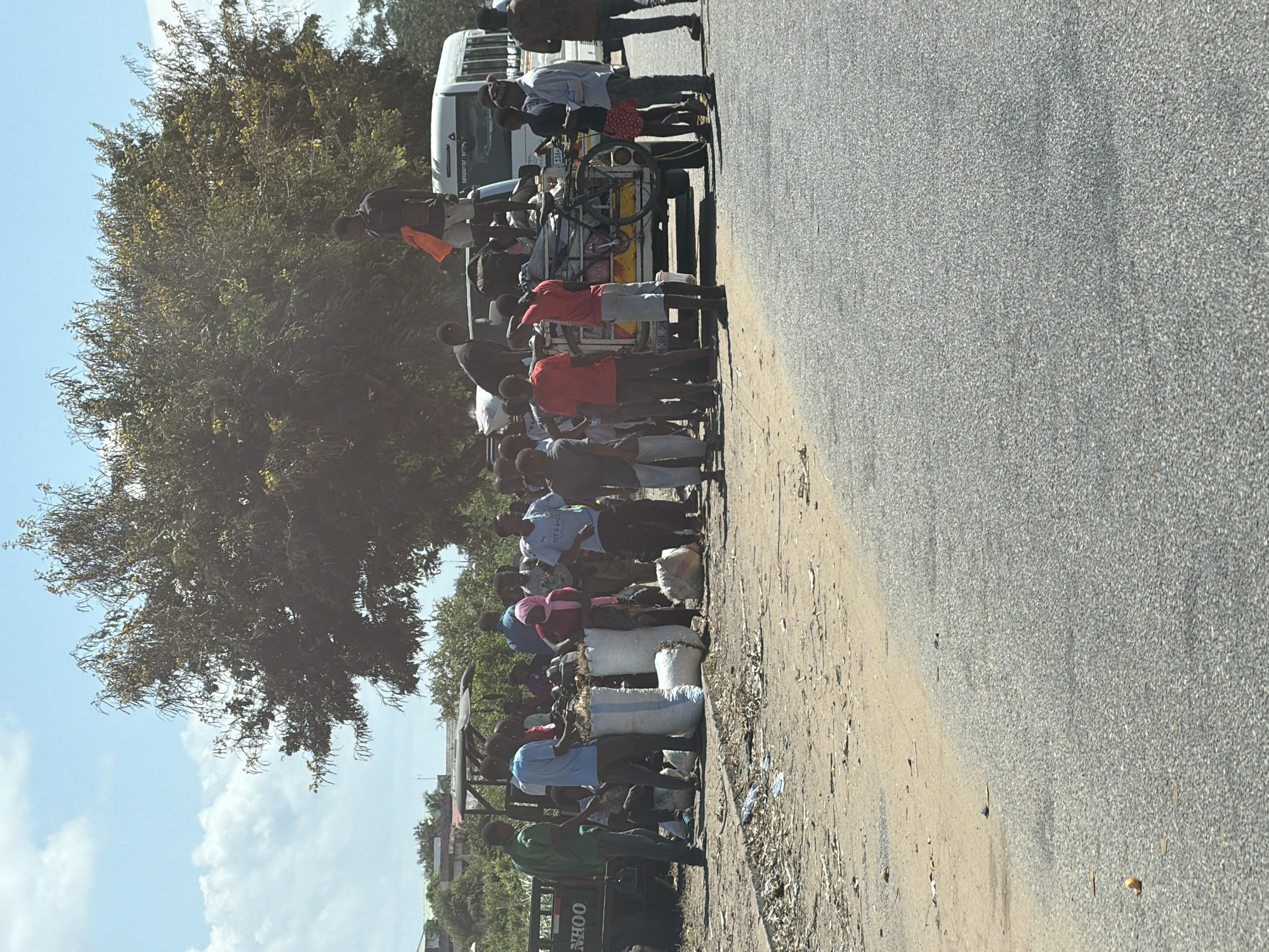 Crowd surrounds possibly overloaded vehicle in Pemba, Mozambique