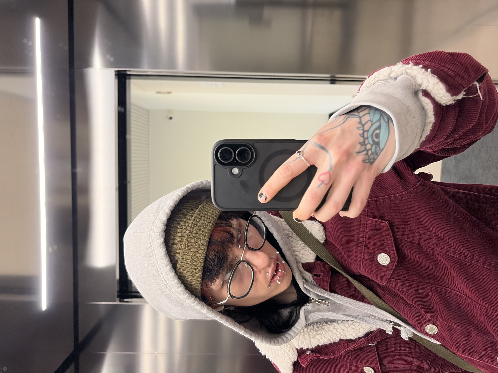 Person takes selfie in elevator in Busmantsi, Bulgaria