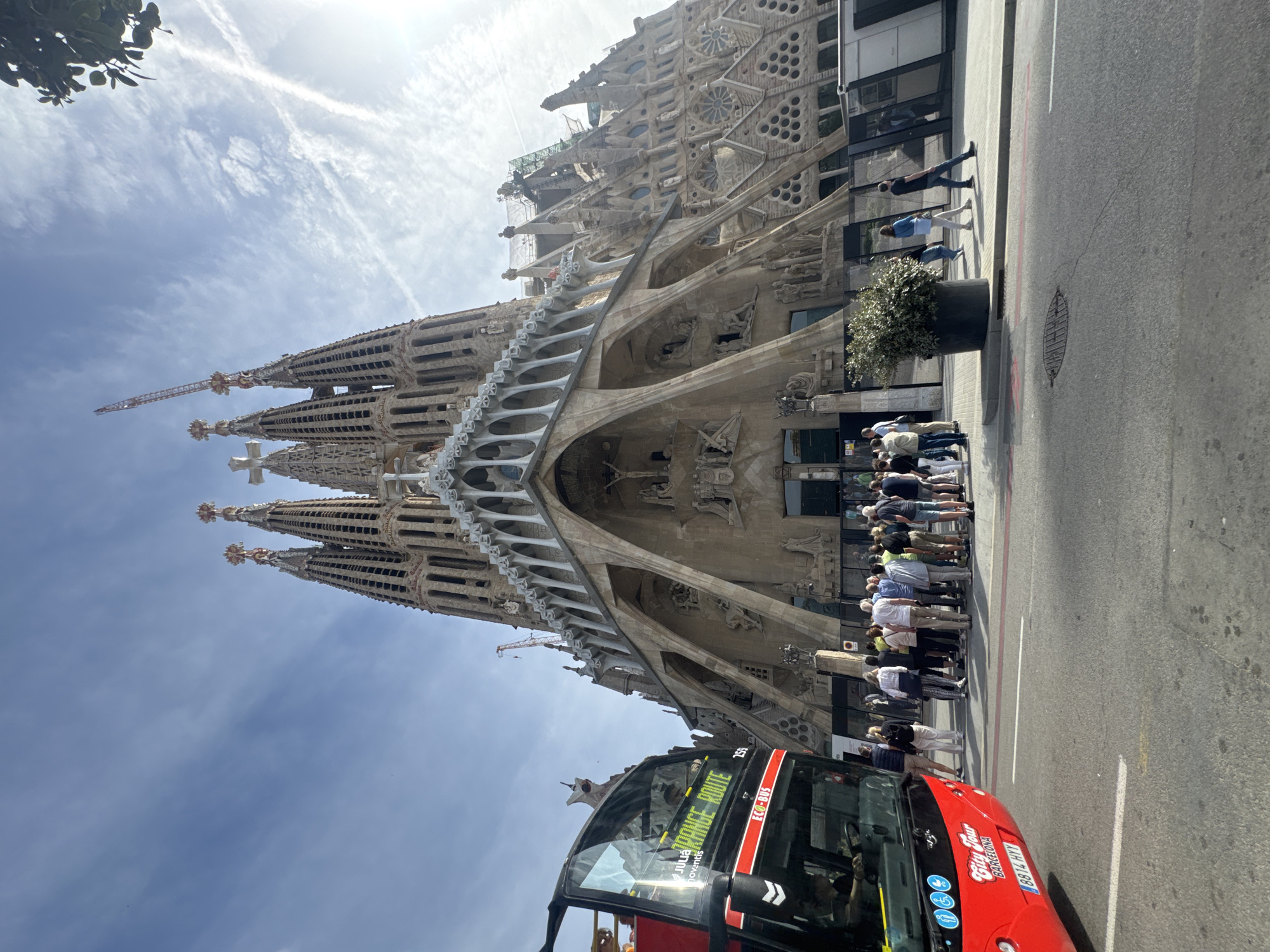 Tourist with walking stick visits Sagrada Familia in Barcelona