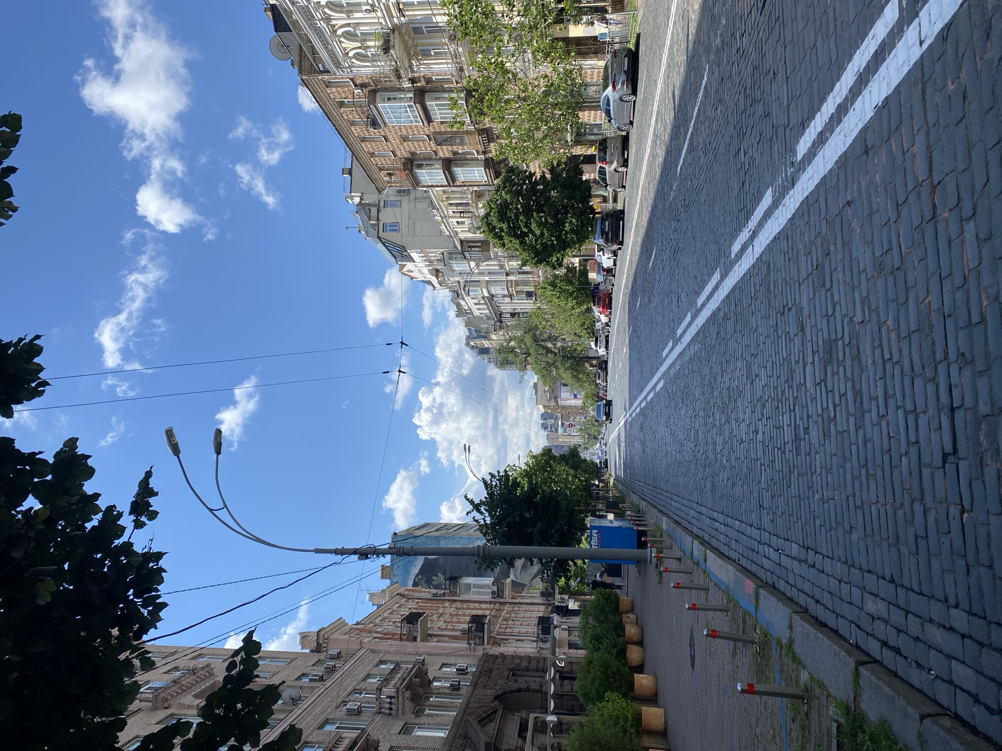 Sunny morning street scene along a historic Kyiv boulevard