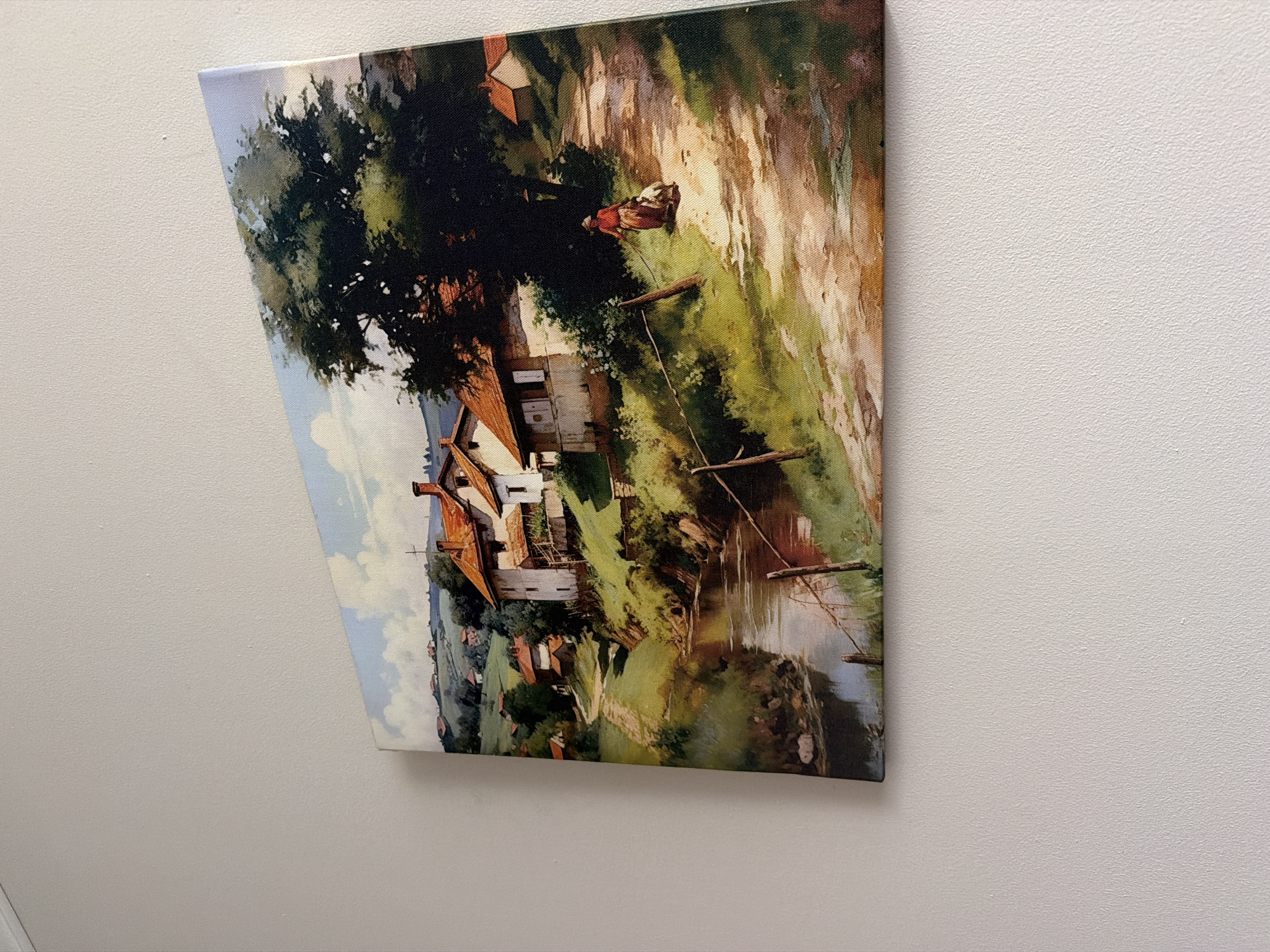Crooked landscape painting observed on textured wall
