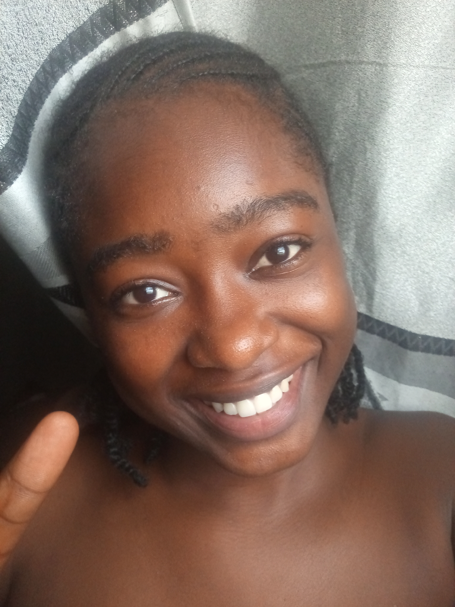 Young woman takes selfies outside church in Nigeria