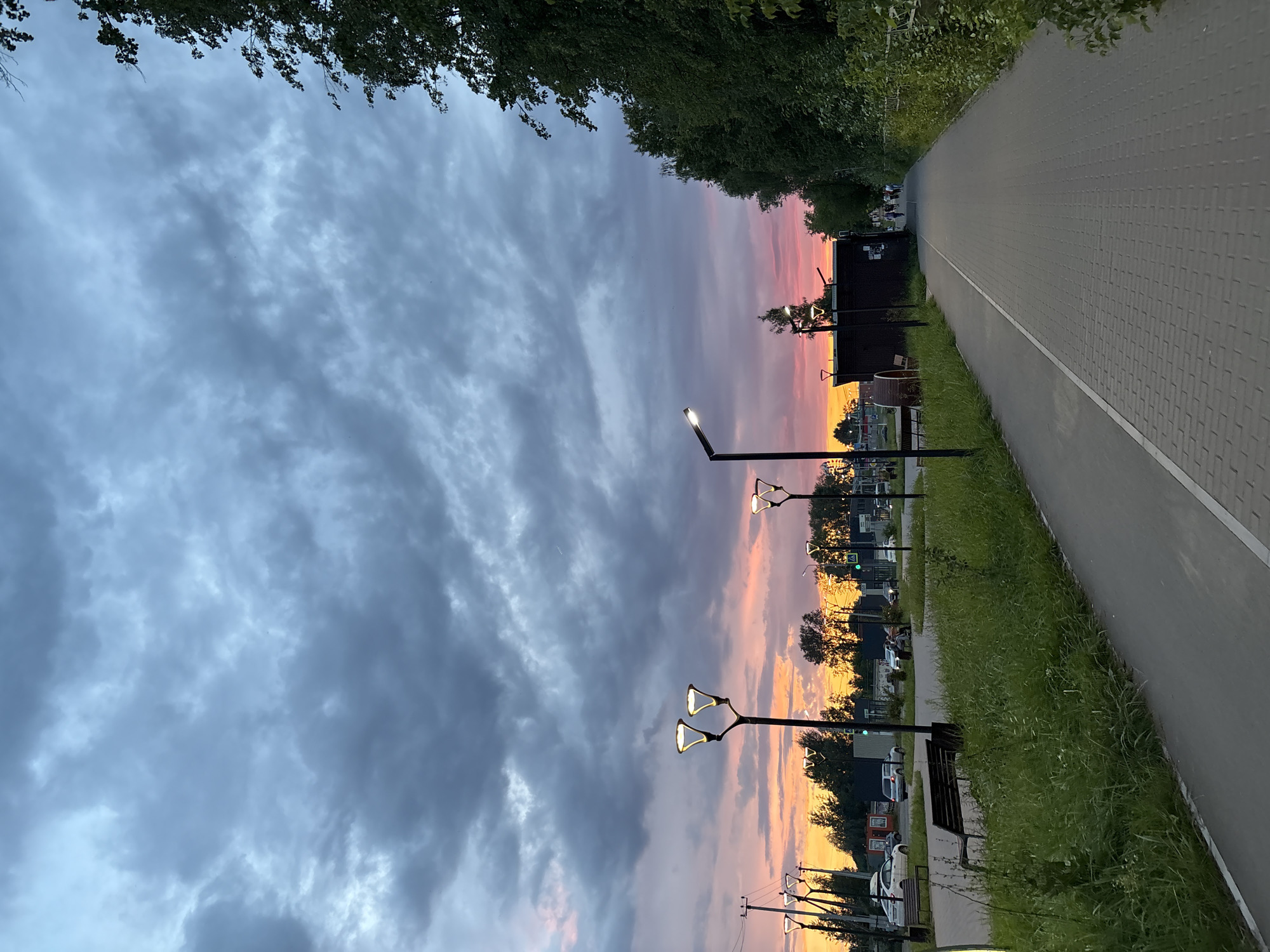 Sunset over a curved walkway as dusk settles in