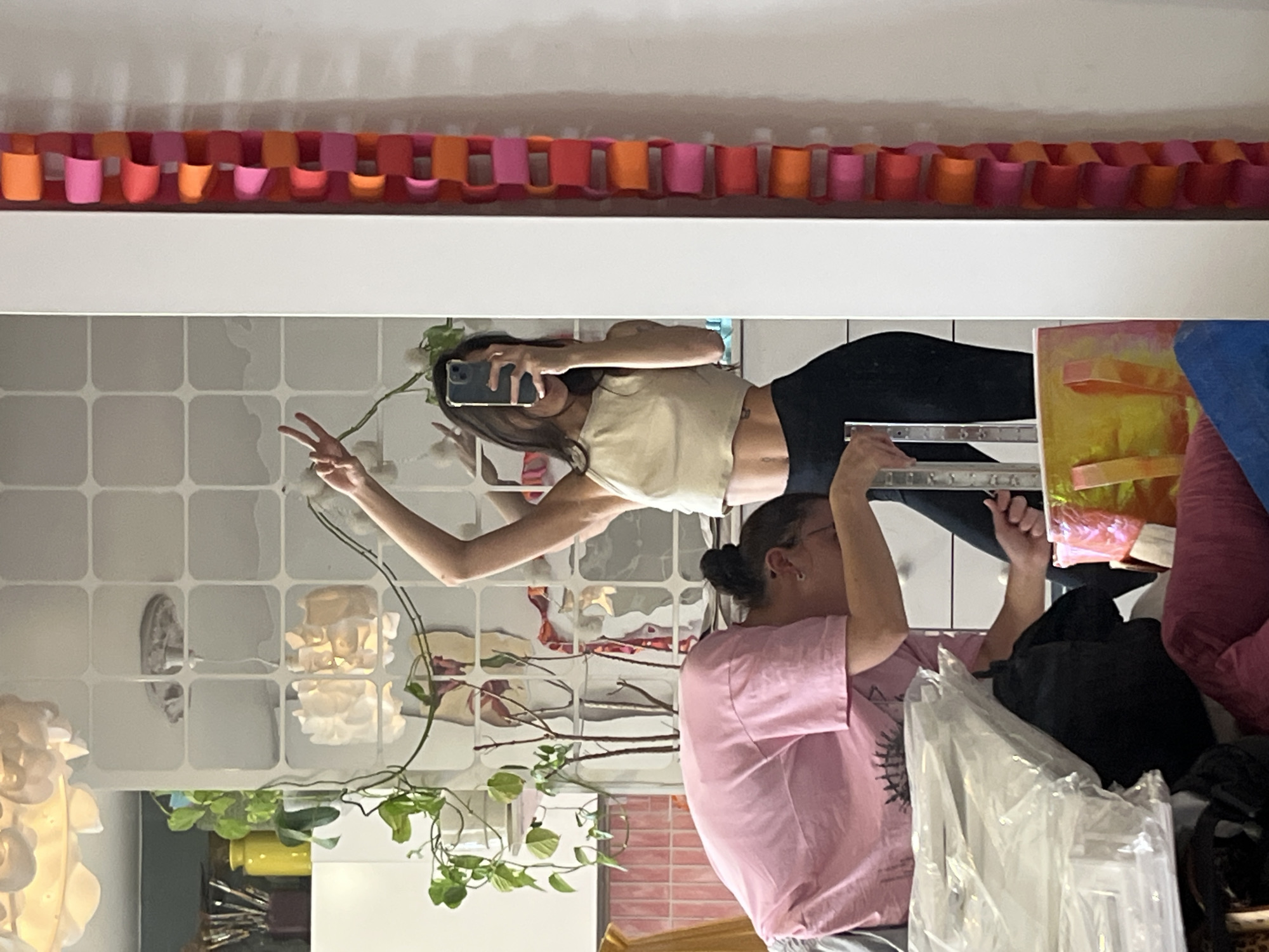 Women take mirror selfie in decorated room, Krasnoyarsk