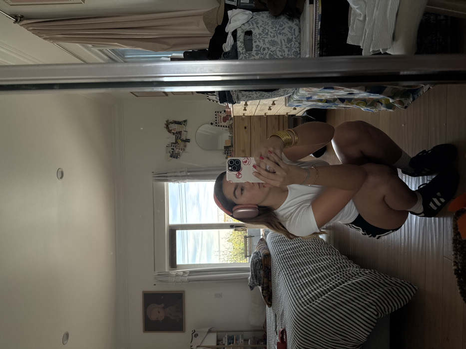 Woman Takes Mirror Selfie in Los Angeles Bedroom