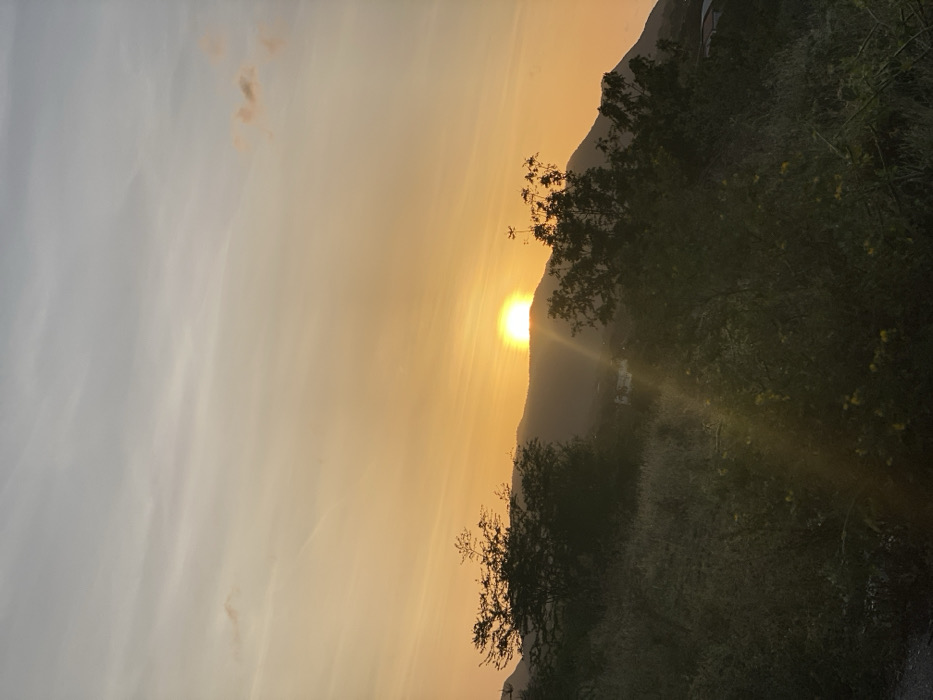 Couple documents sunset visit to Venezuelan hillside overlook