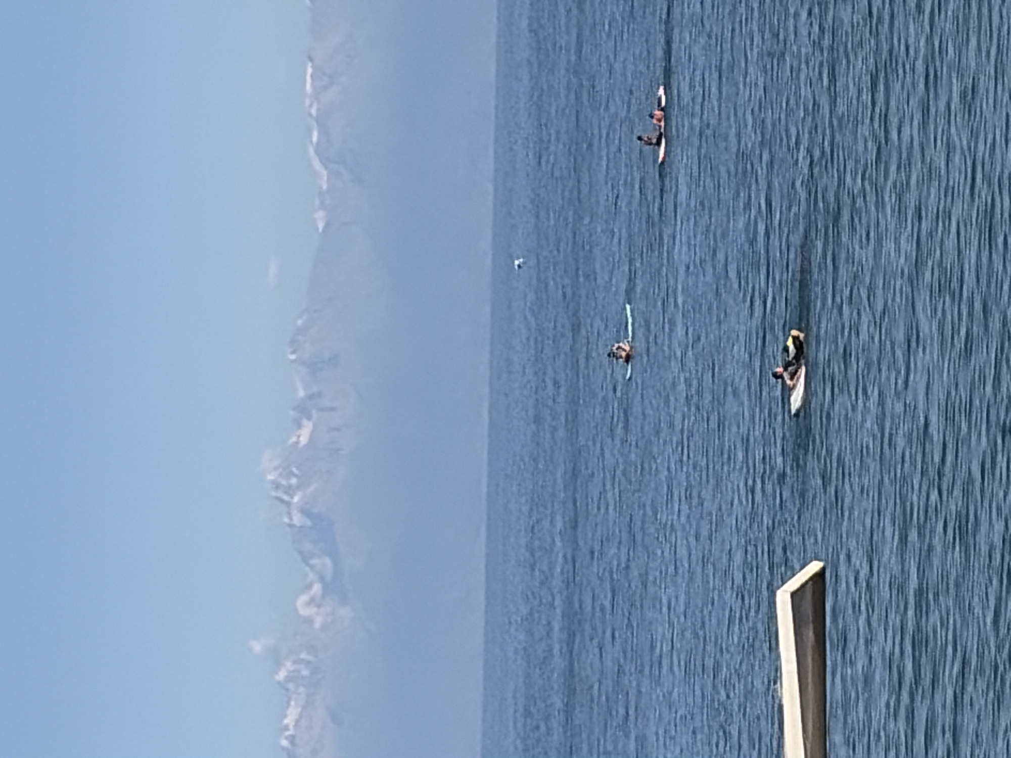 Watersports and beach hangout with mountain views
