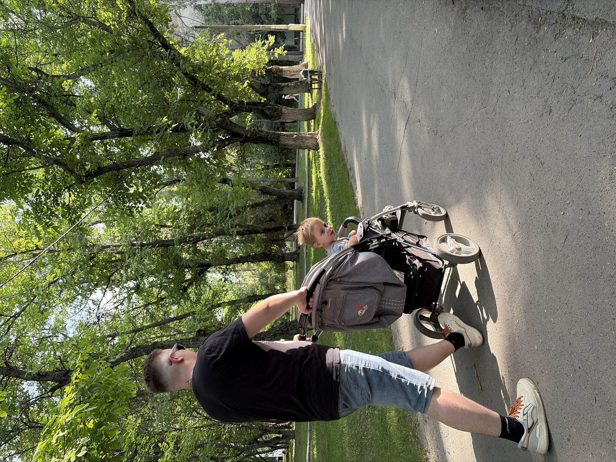 Busy park afternoon with families, walkers, and cyclists