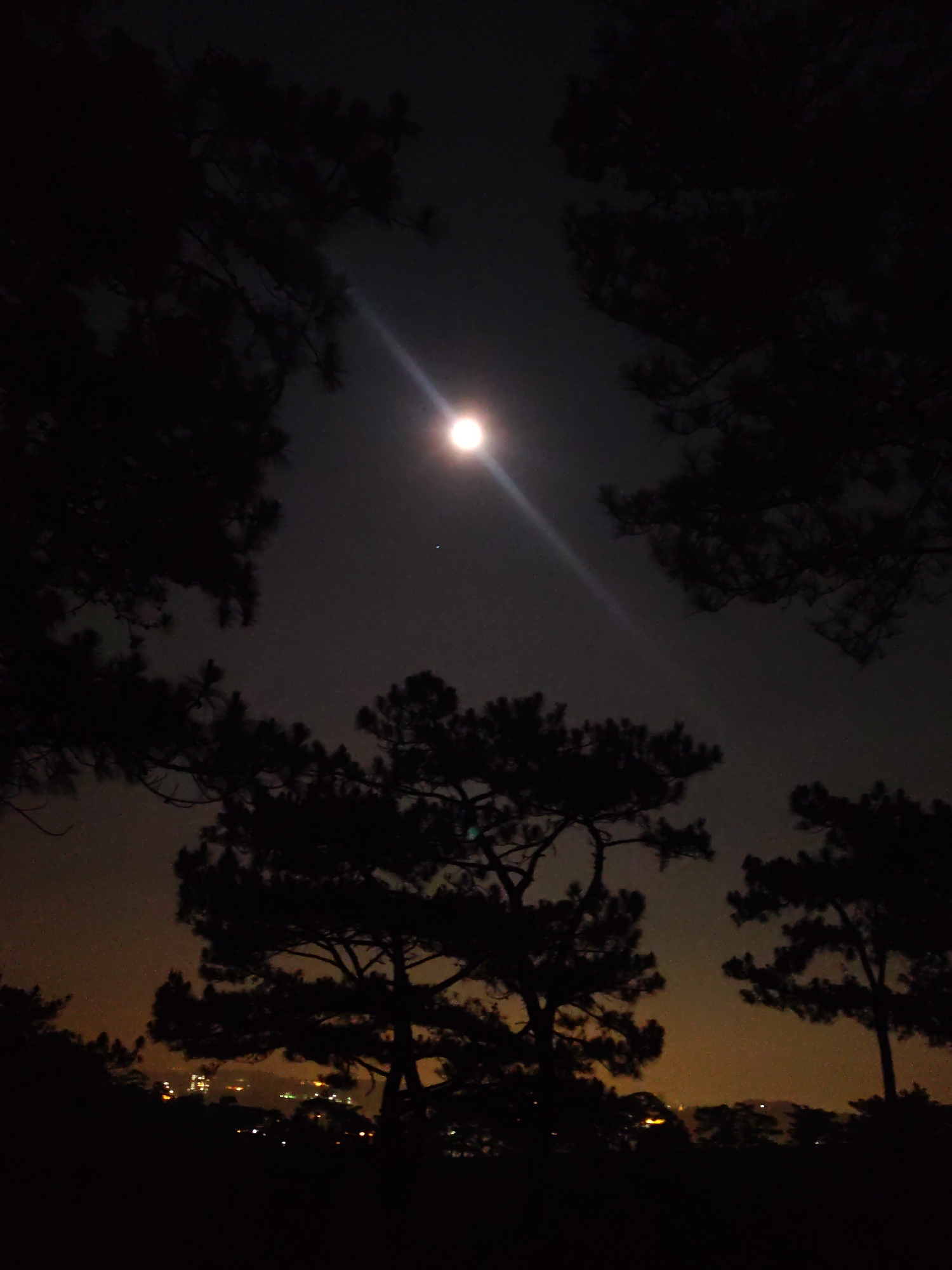 Bright full moon captured over Da Lat Vietnam countryside