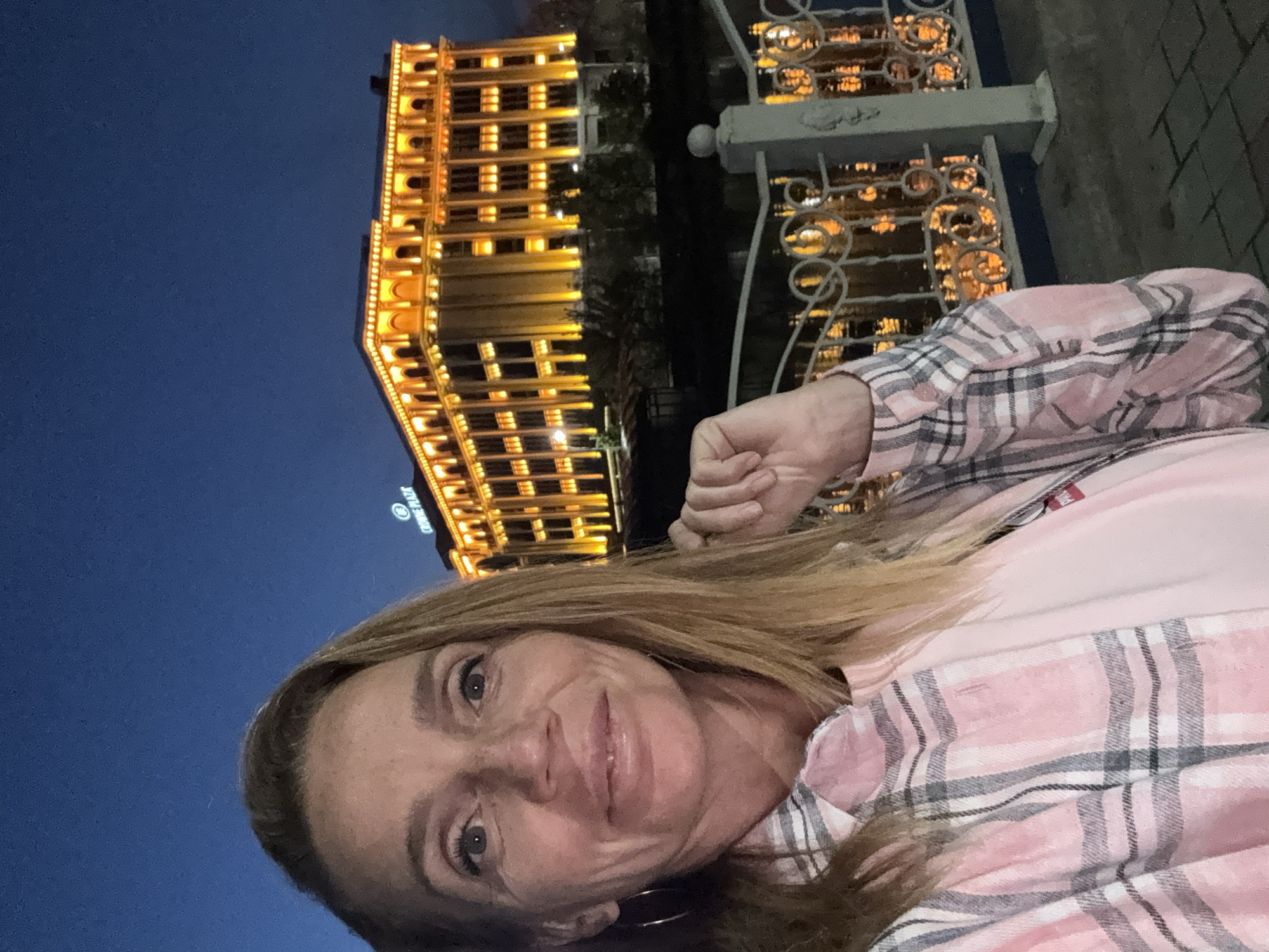 Nighttime scenes captured around illuminated Crowne Plaza Hotel in Tashkent