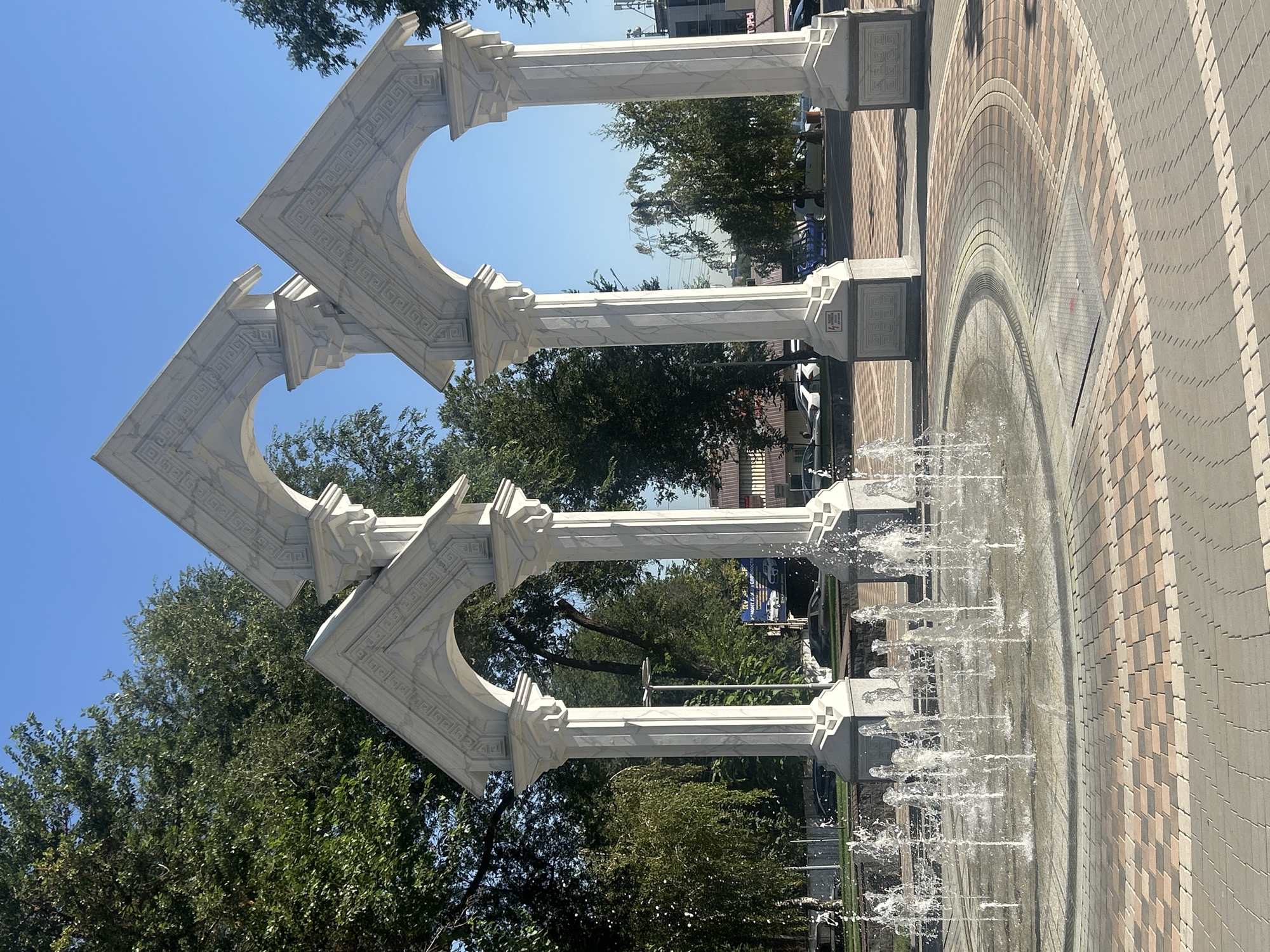 Fountain and marble archway at an Almaty public square
