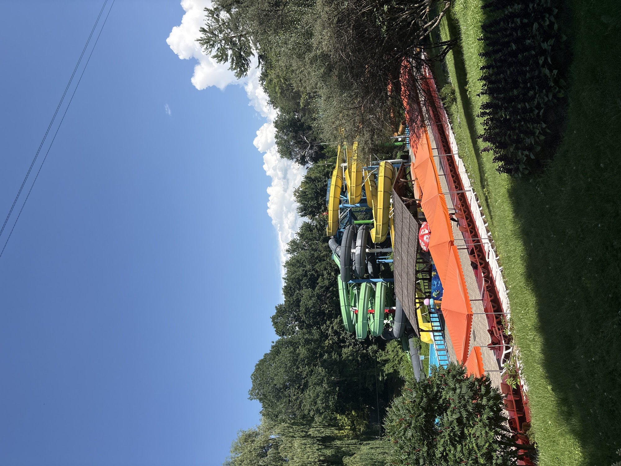 Summer water park day in Almaty with pools and slides