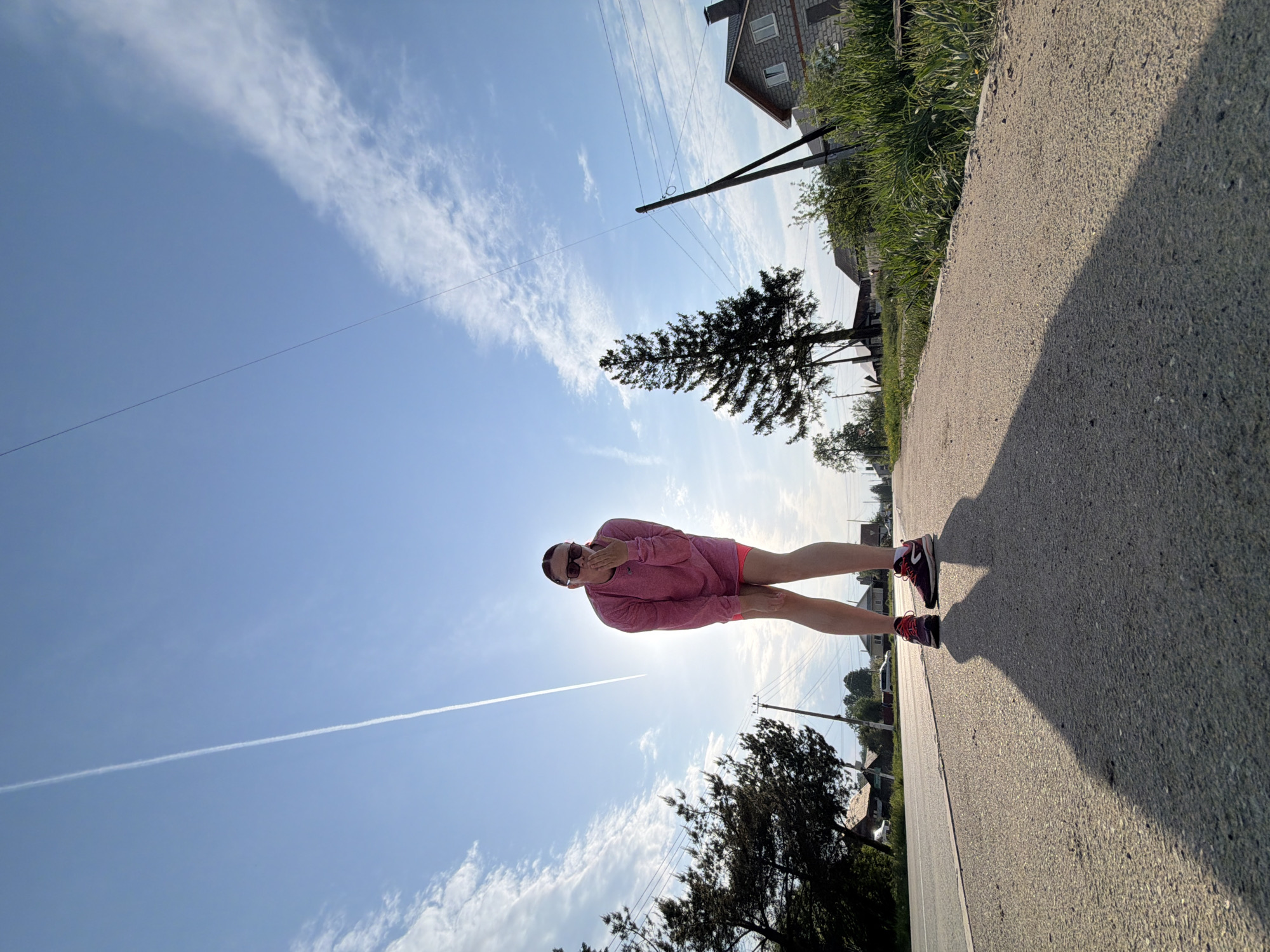 Person in pink outfit walks streets of Chaikovsky, Russia