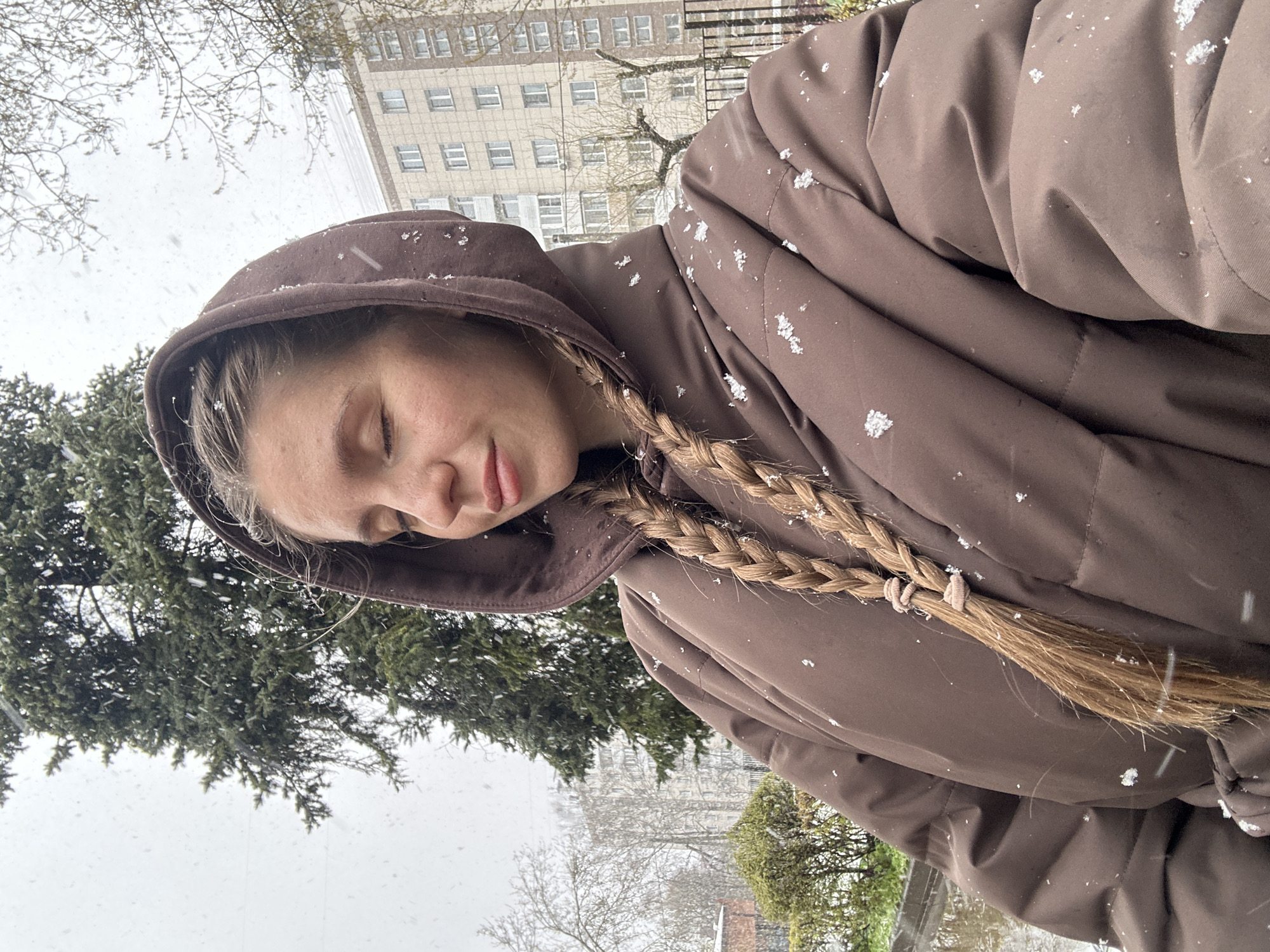 Woman and toddler enjoy snowy afternoon in Klin, Russia