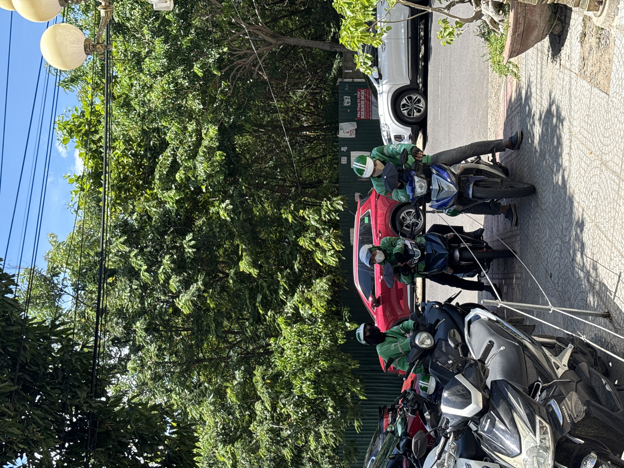 Motorcycle riders and street style on a Nha Trang sidewalk
