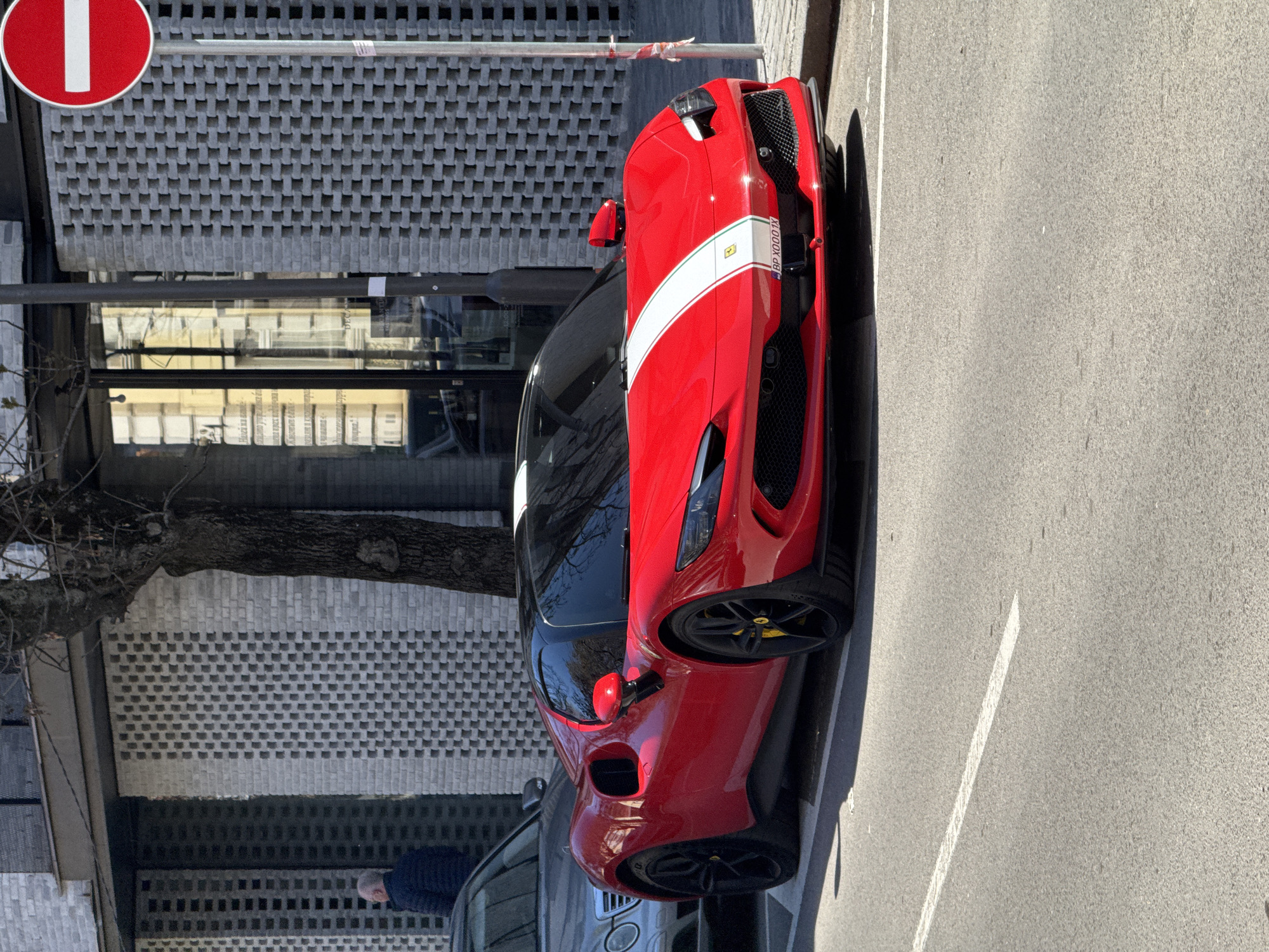 Red Ferrari SF90 spotted parked on Sofia street
