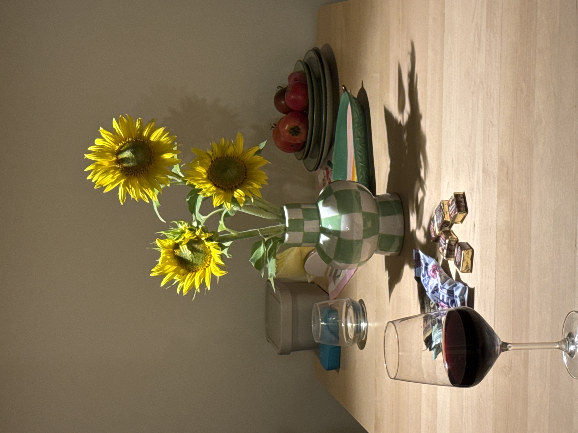 Red wine and sunflowers on a wooden table in Izhevsk