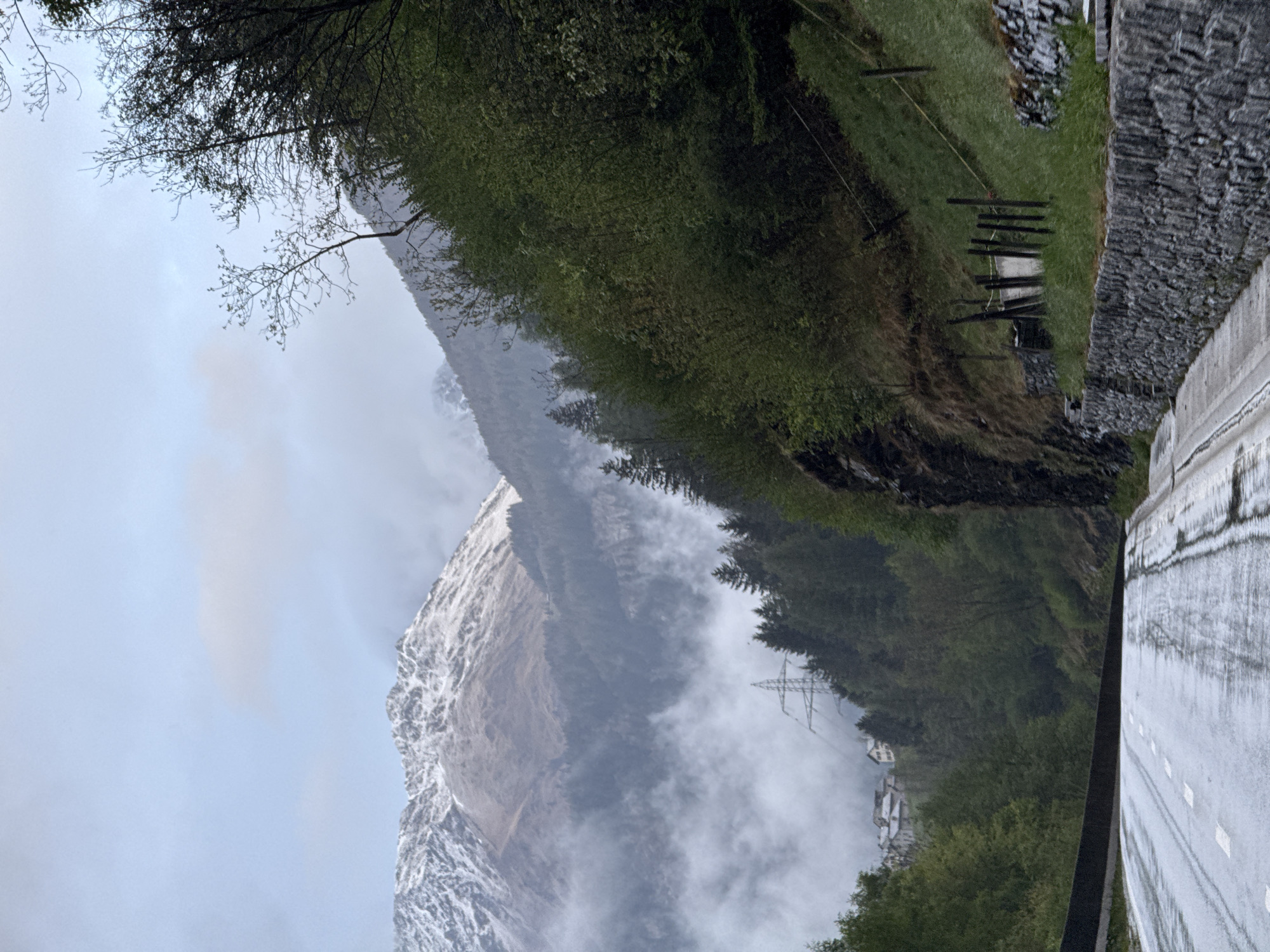 Misty mountain landscape photographed in San Carlo, Switzerland
