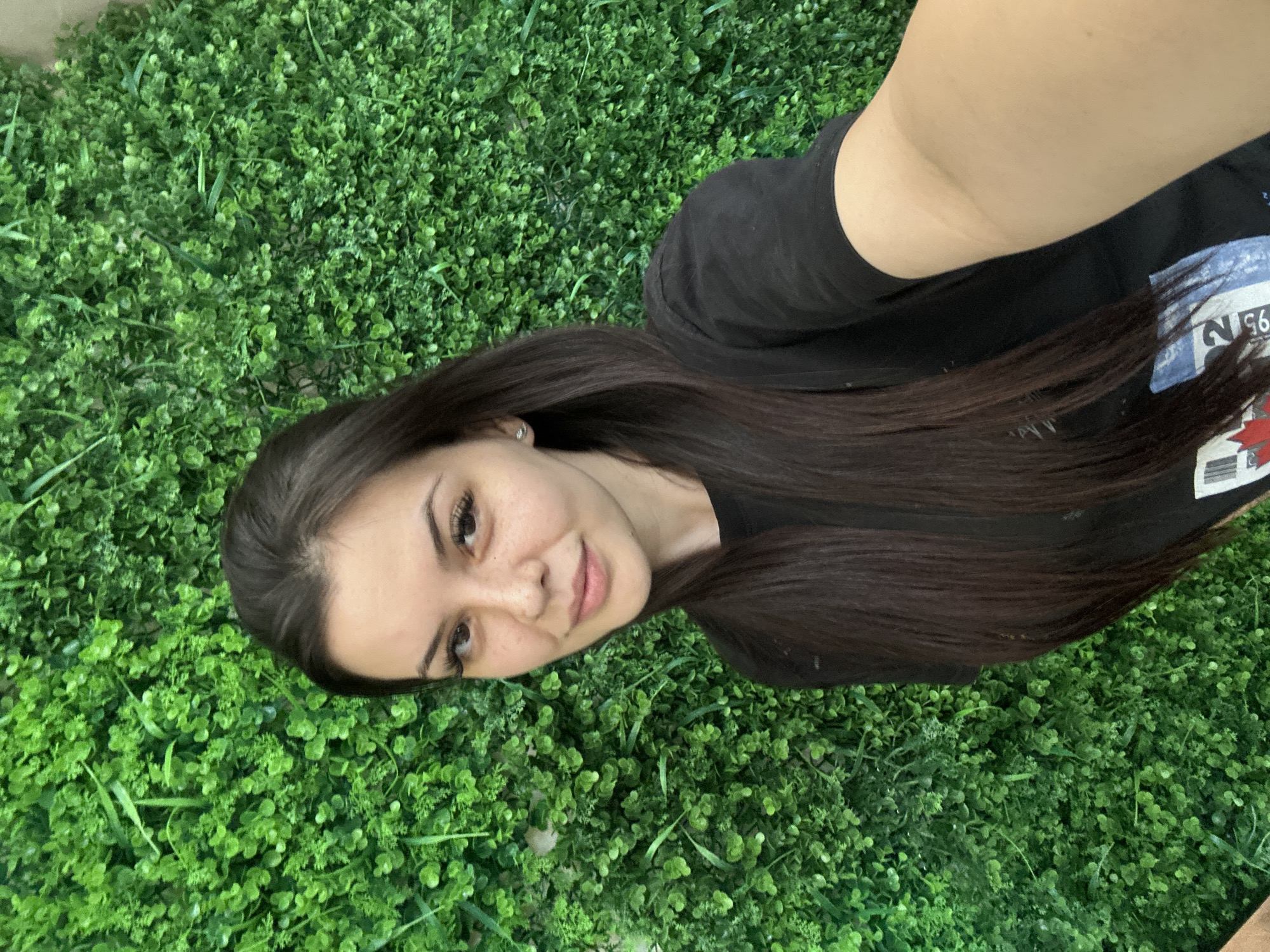 Quick selfie session against a green hedge wall in Sliven