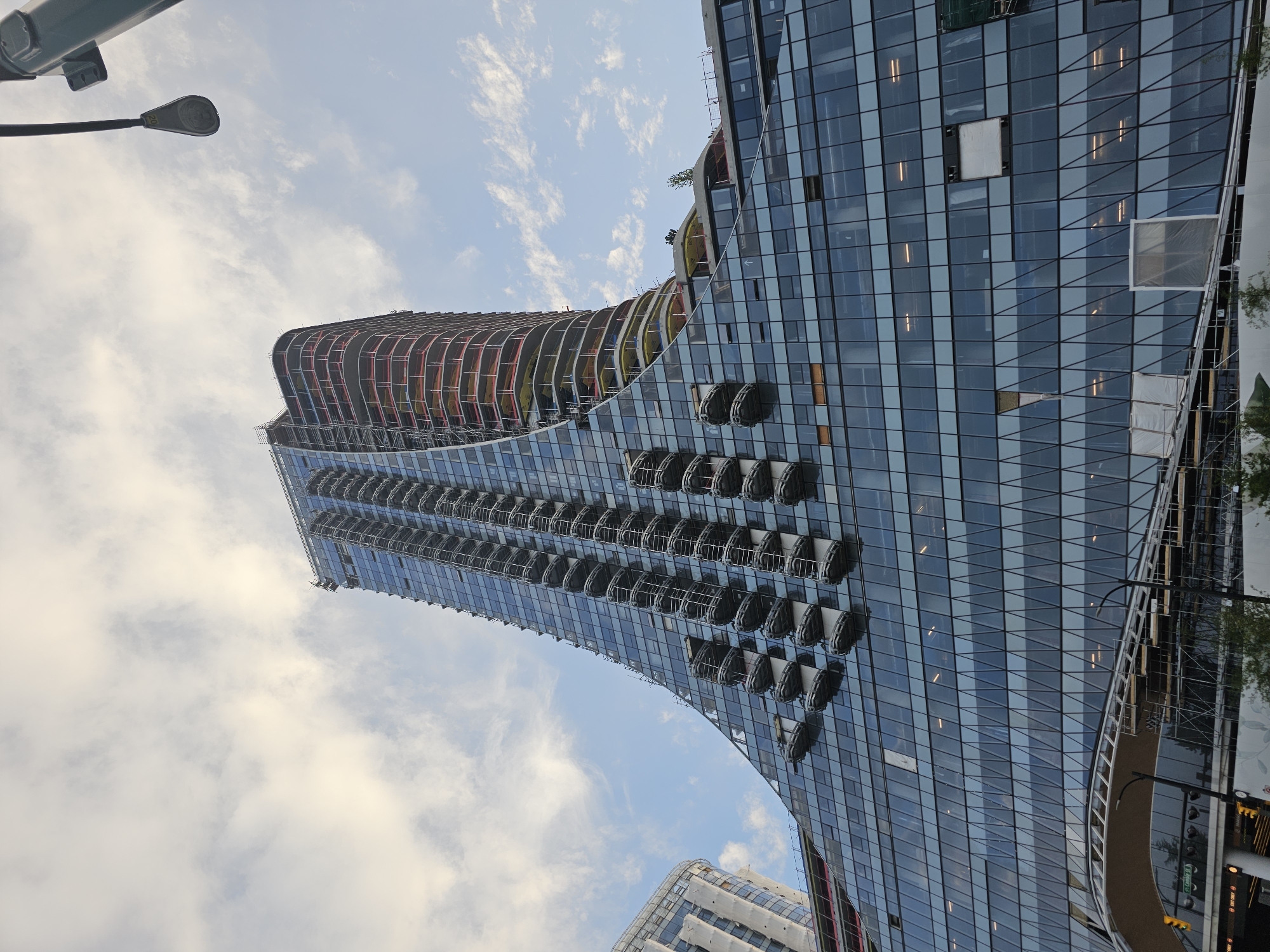 Vancouver's curving glass tower under construction, balconies and all