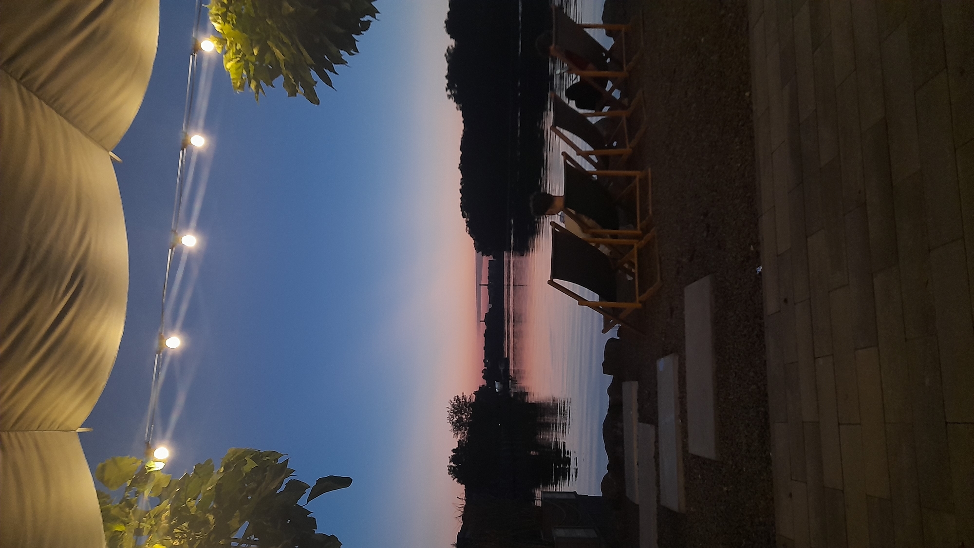 Dusk at a quiet waterside lounge in Khmelnytskyi