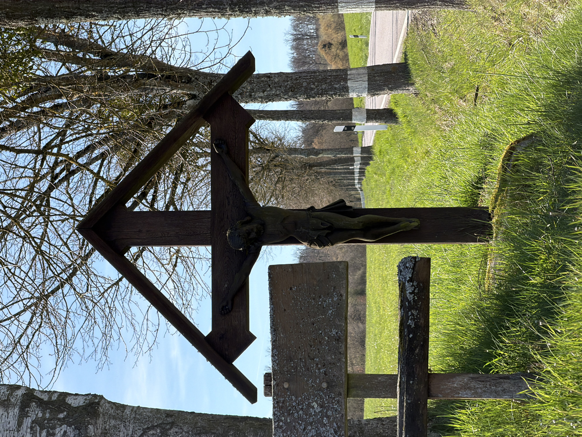 Roadside crucifix shrine documented in rural Junglinster, Luxembourg