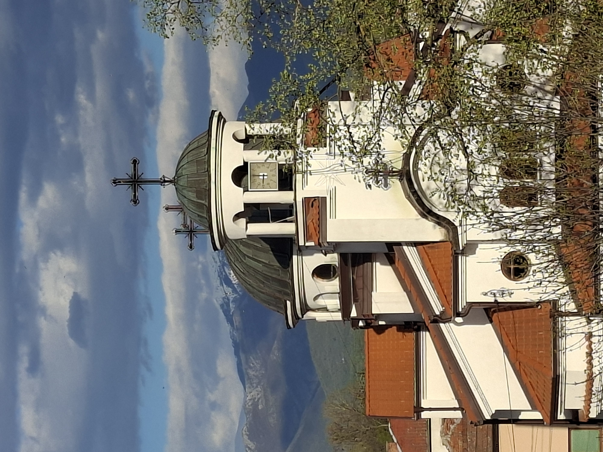 White Orthodox church observed in urban setting