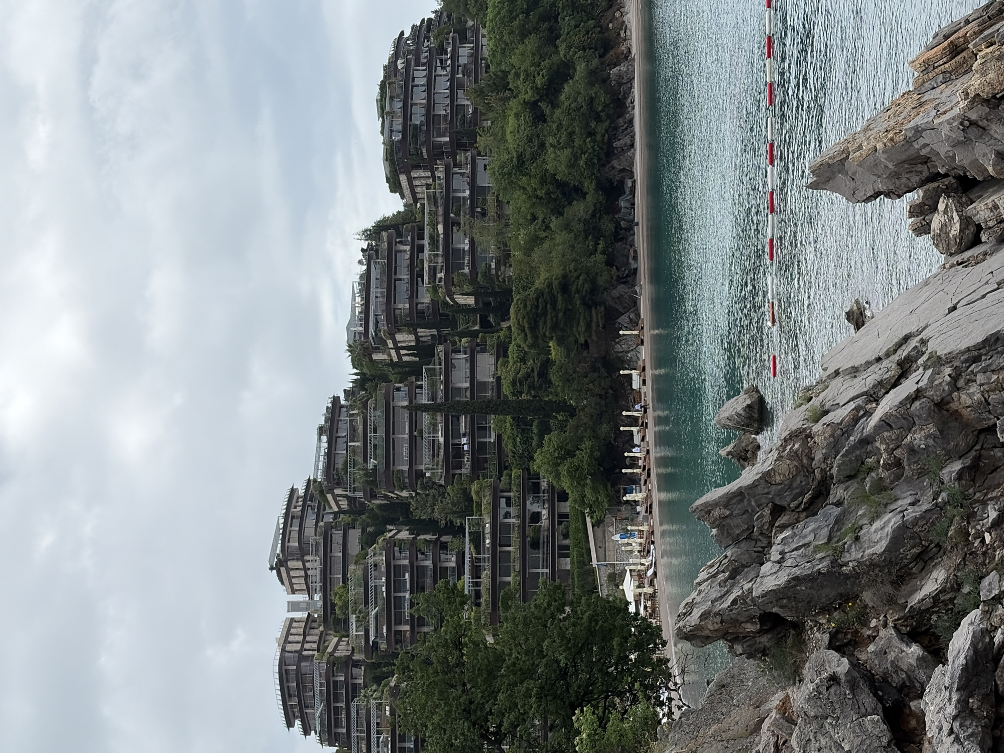 Modern green architecture and beach amenities observed in Budva