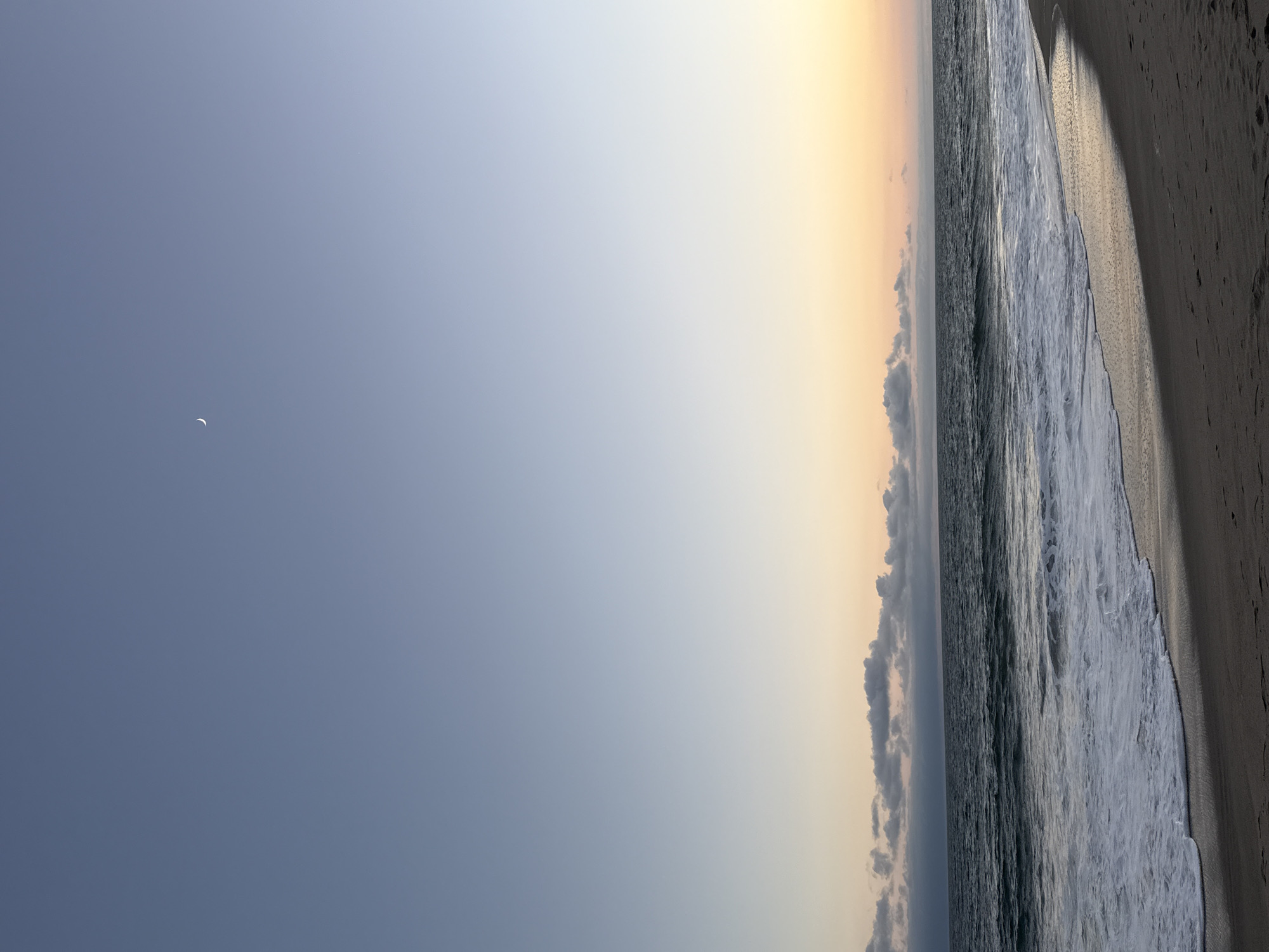 Sunset evening on a Malibu beach with people and waves