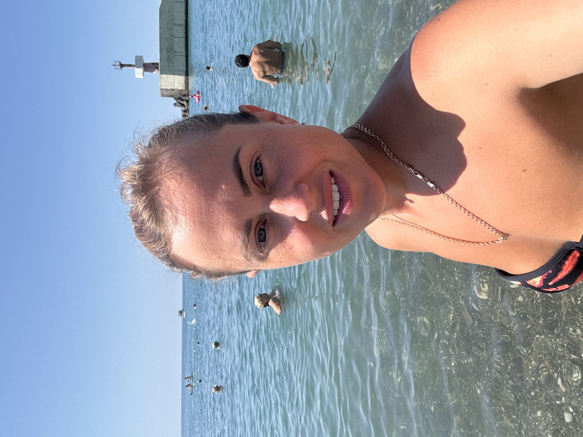 Crowded summer day on Sochi's Black Sea pebble beach