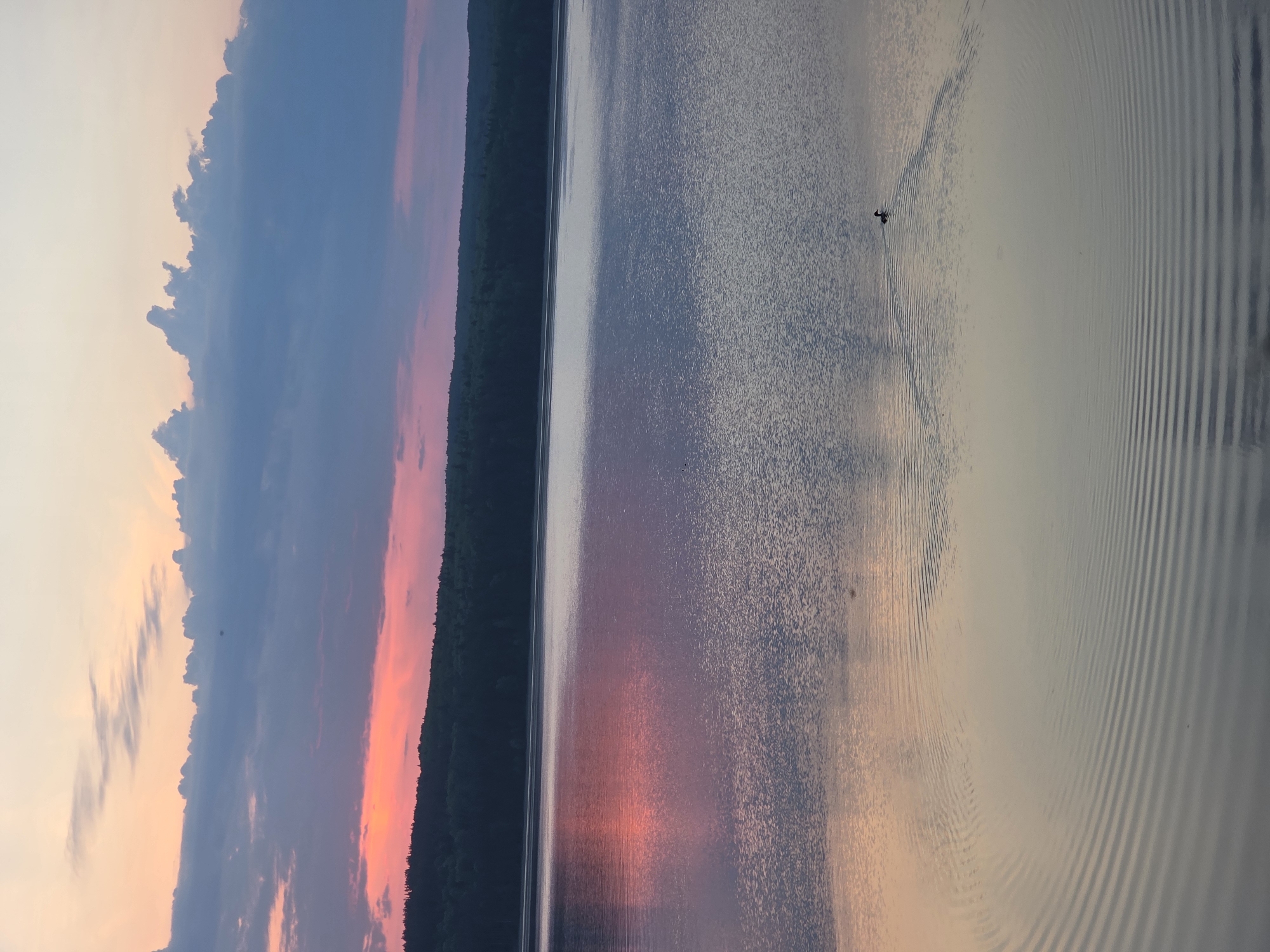 Sunset captured over serene lake in Chaikovsky, Russia