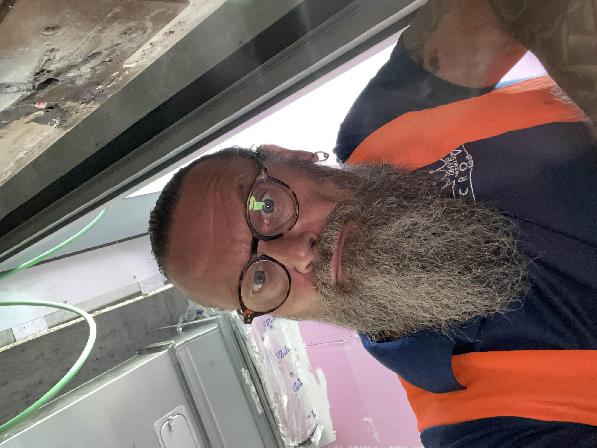 Multiple selfies from Raanana, orange vest, grey beard