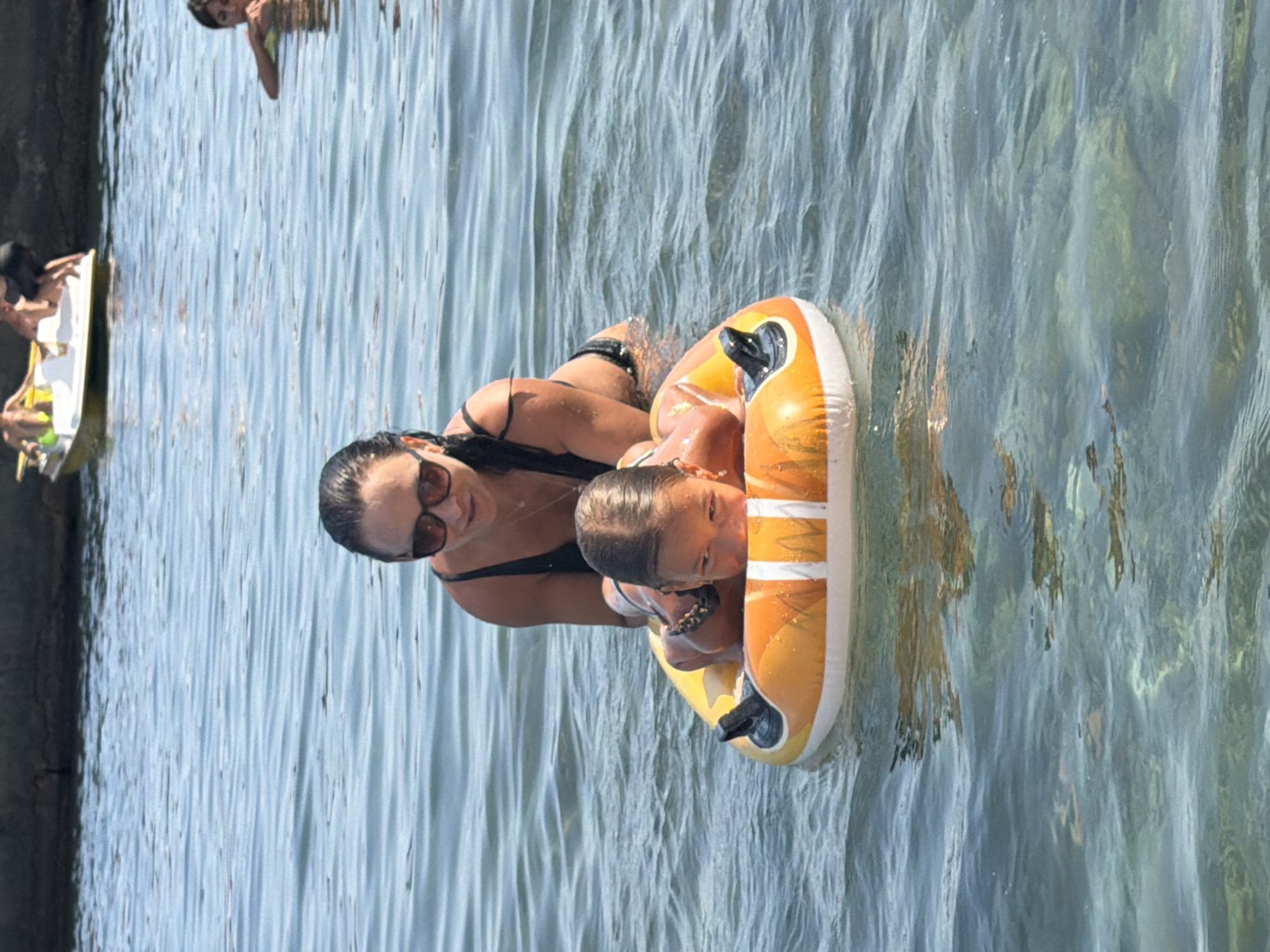 Sunny beach day in Partenit, Ukraine — swimming and floating