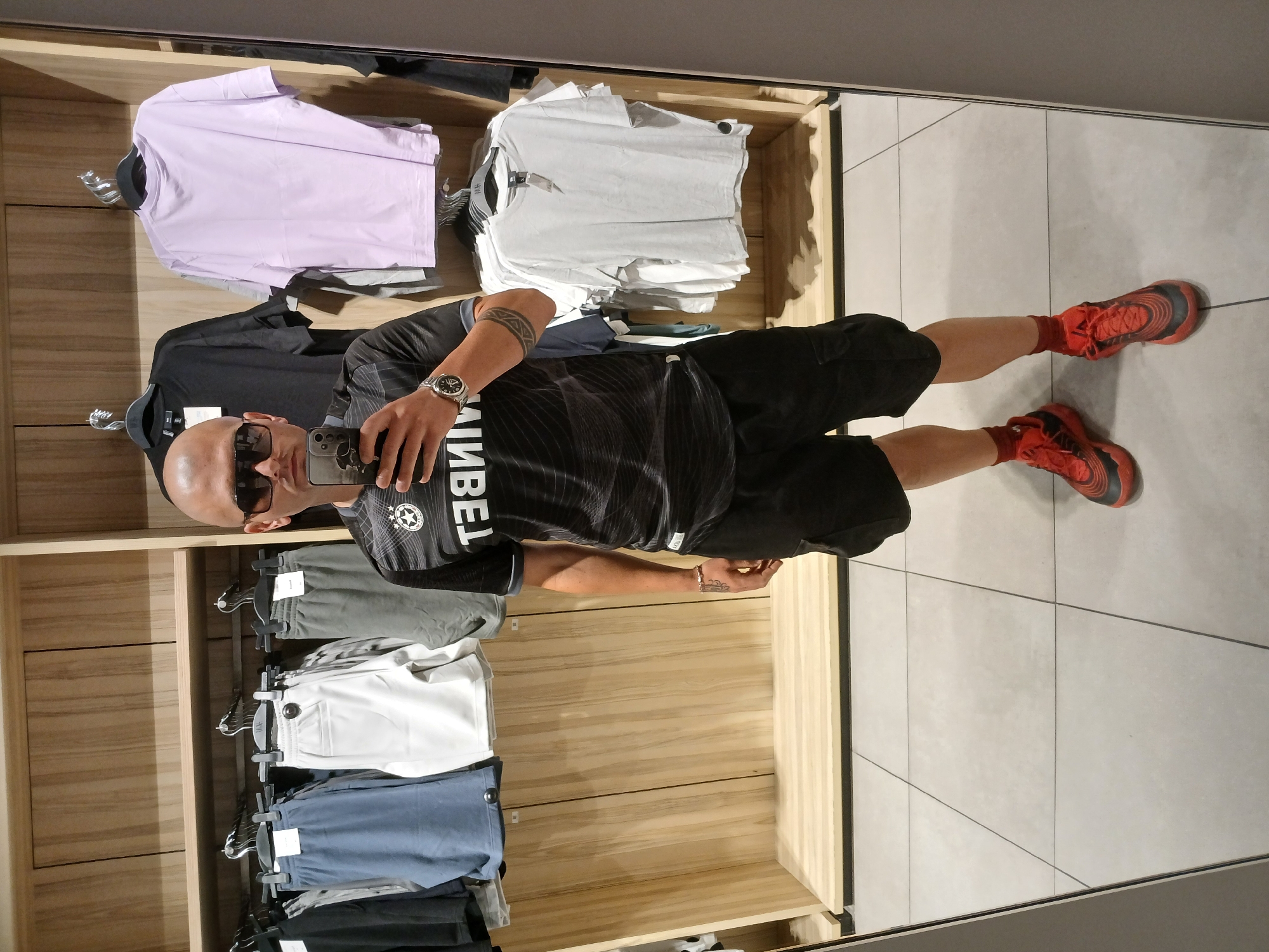 Mirror selfie fit check inside a Blagoevgrad clothing store
