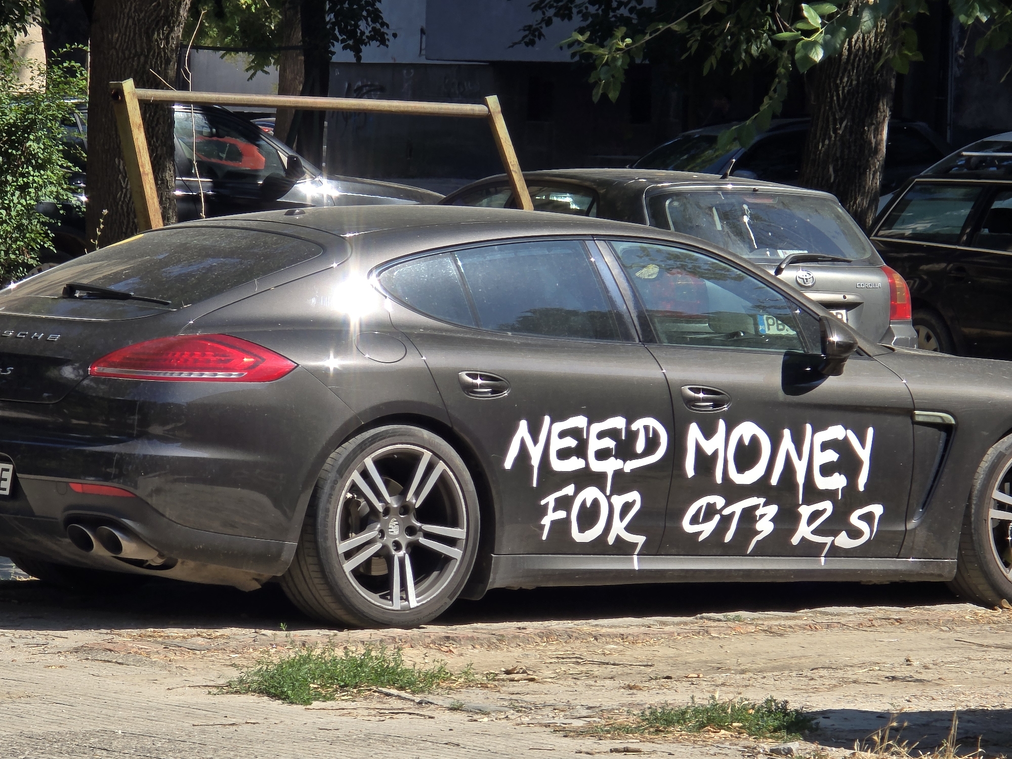 Porsche Panamera spotted with graffiti begging for a GT3 RS