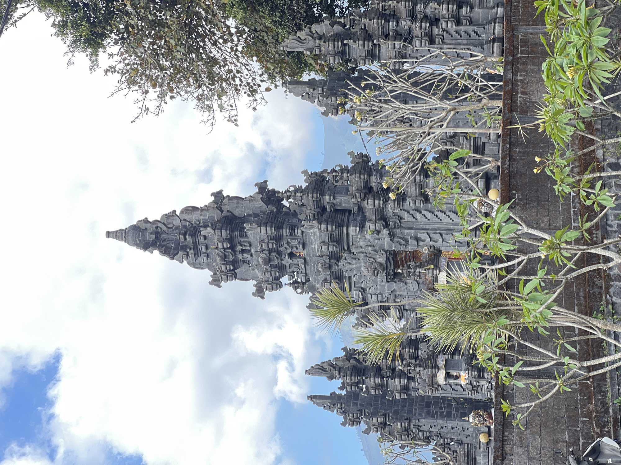 Ornate temple architecture and marigolds in Kintamani, Bali