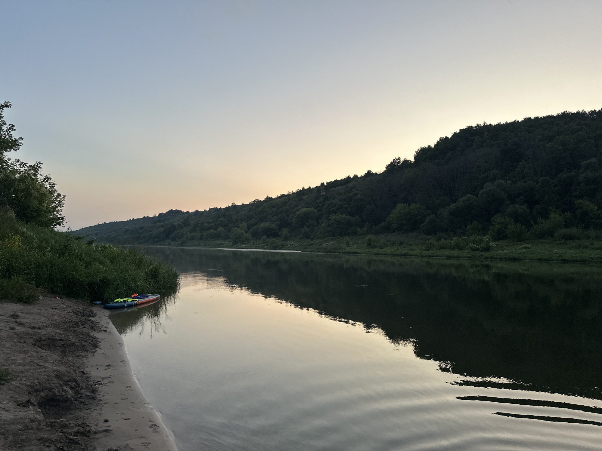 Dusk settles over a quiet river near Alekseevka