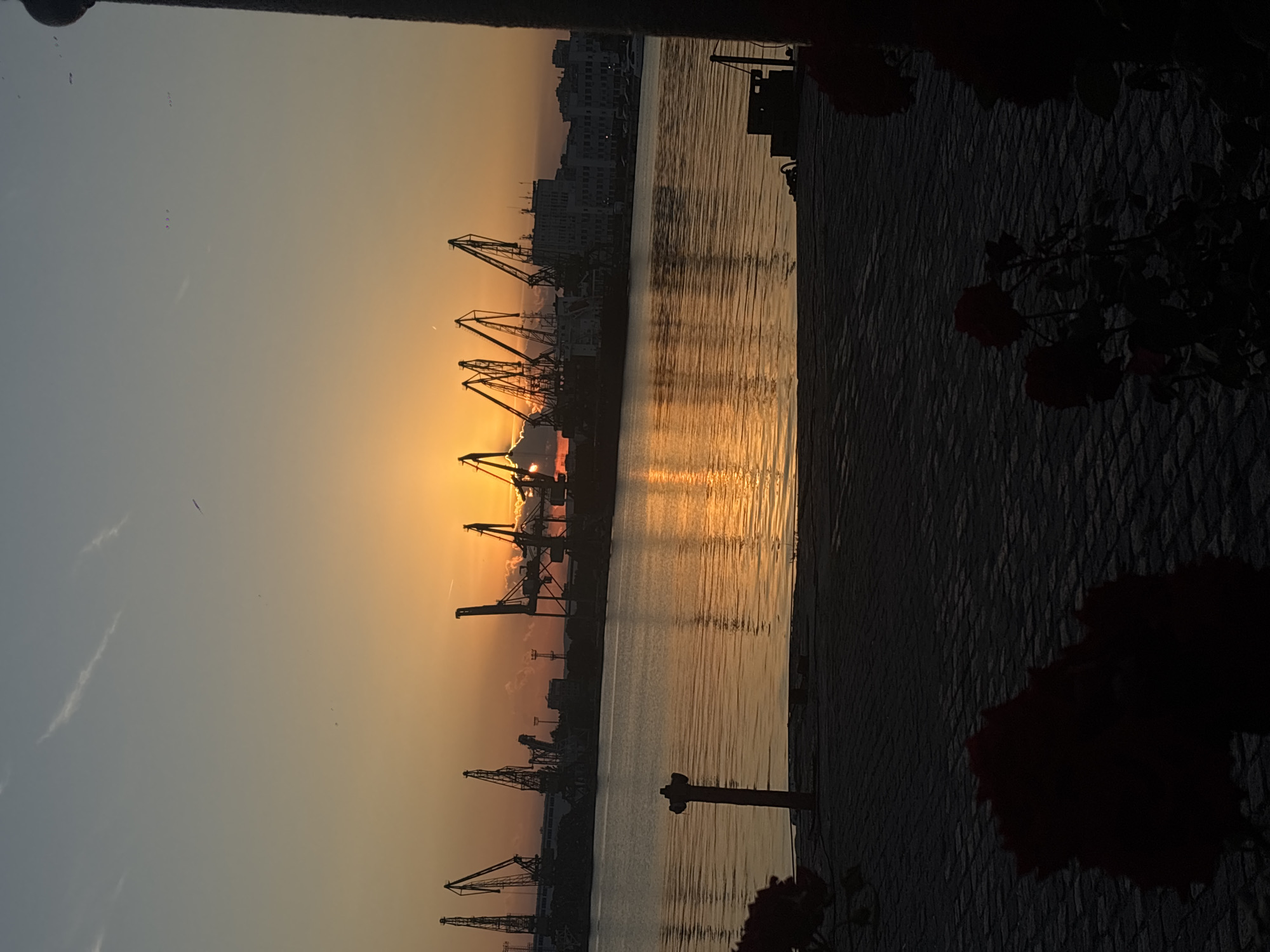 Varna's waterfront at golden hour, port and promenade
