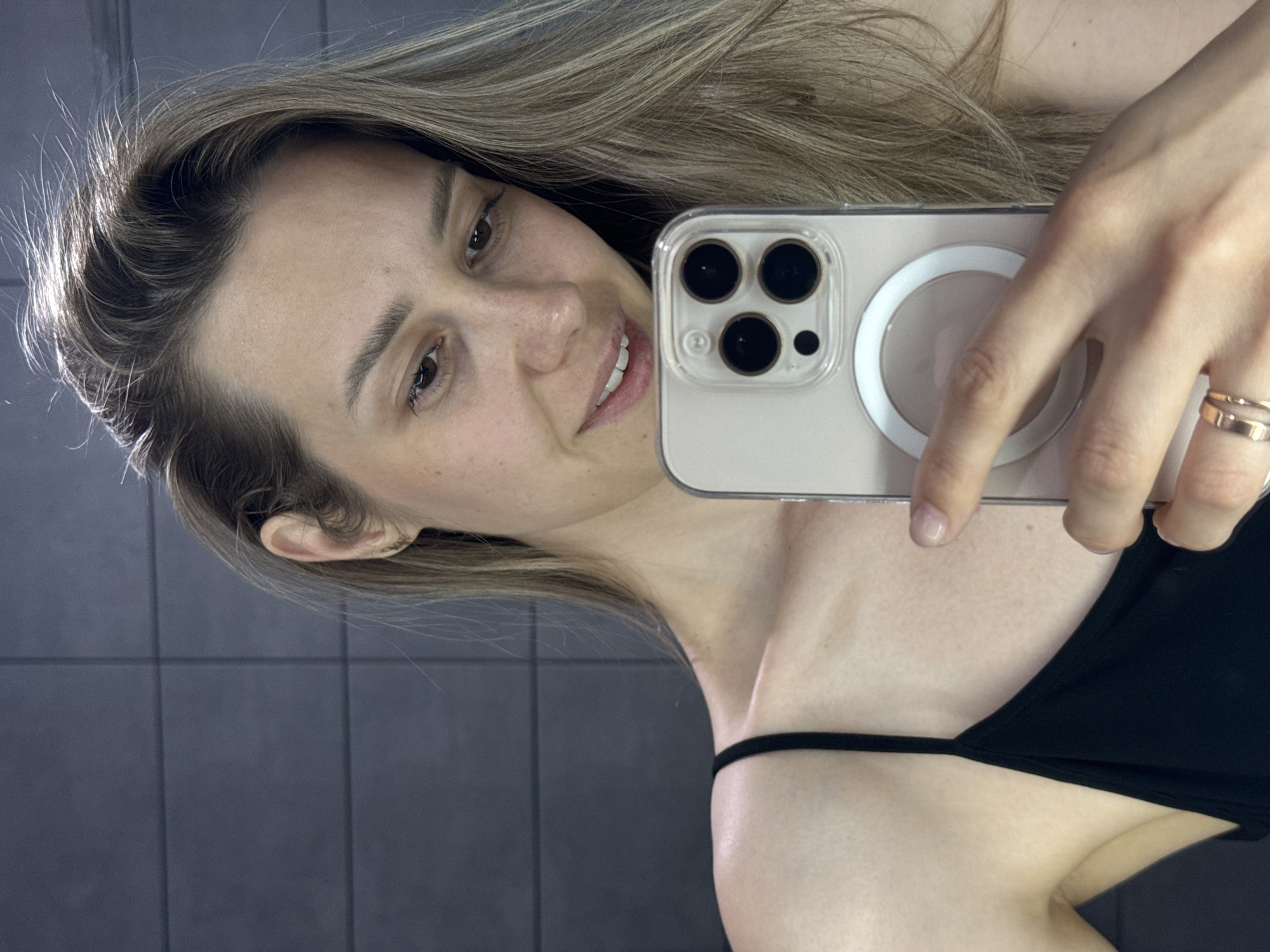Woman takes selfies indoors in Chaikovsky, Russia