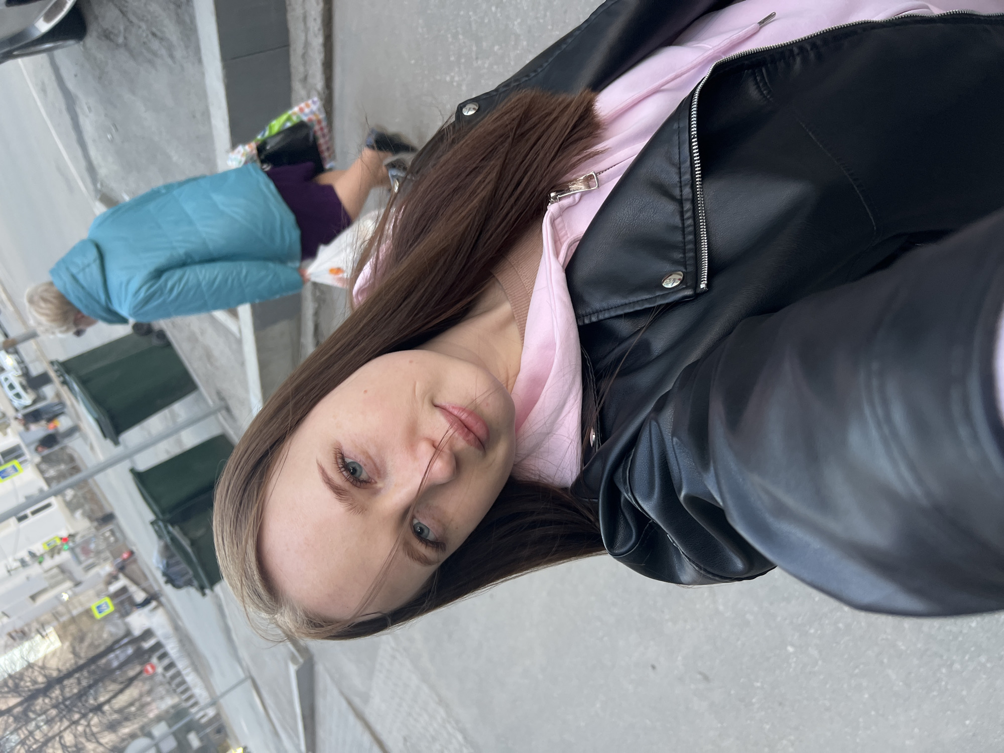 Woman takes mirror selfies on Perm street