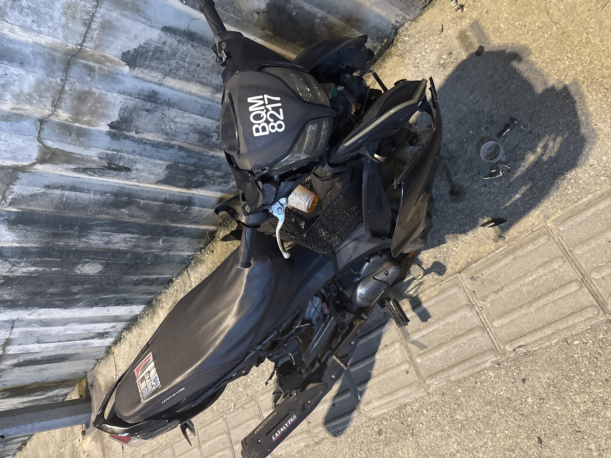 Damaged scooter found on sidewalk in Kuala Lumpur