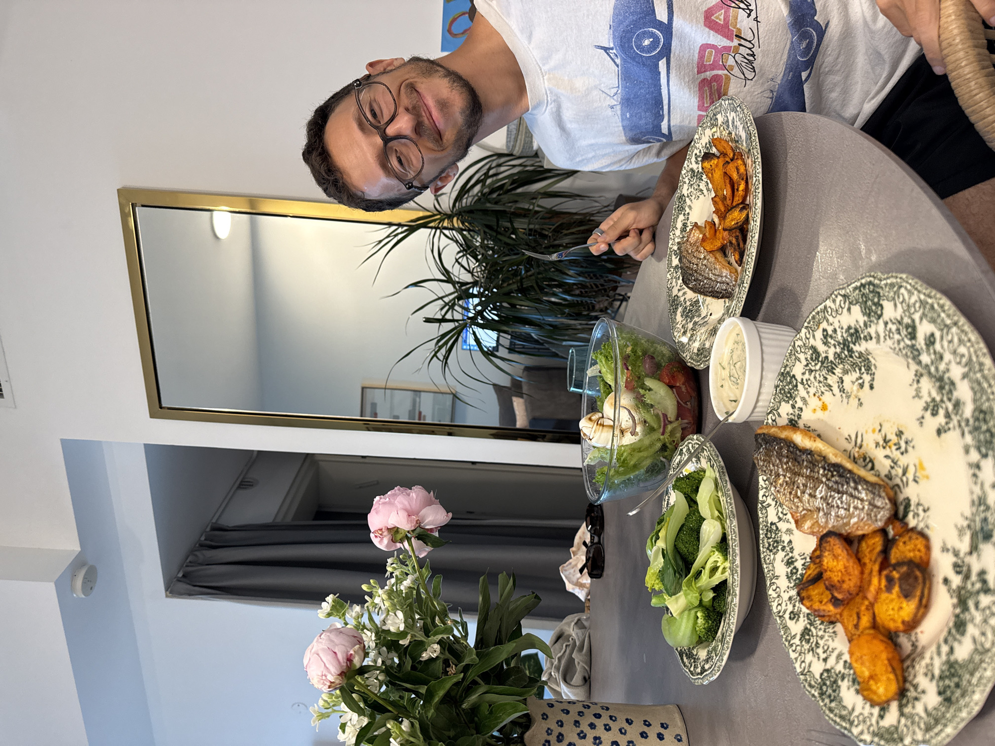 Man with glasses observed dining at Tel Aviv apartment table