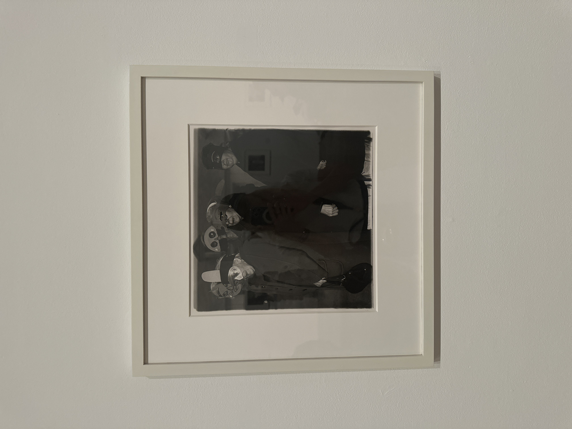 Mixed-media art exhibition with photography, abstraction, and textile works